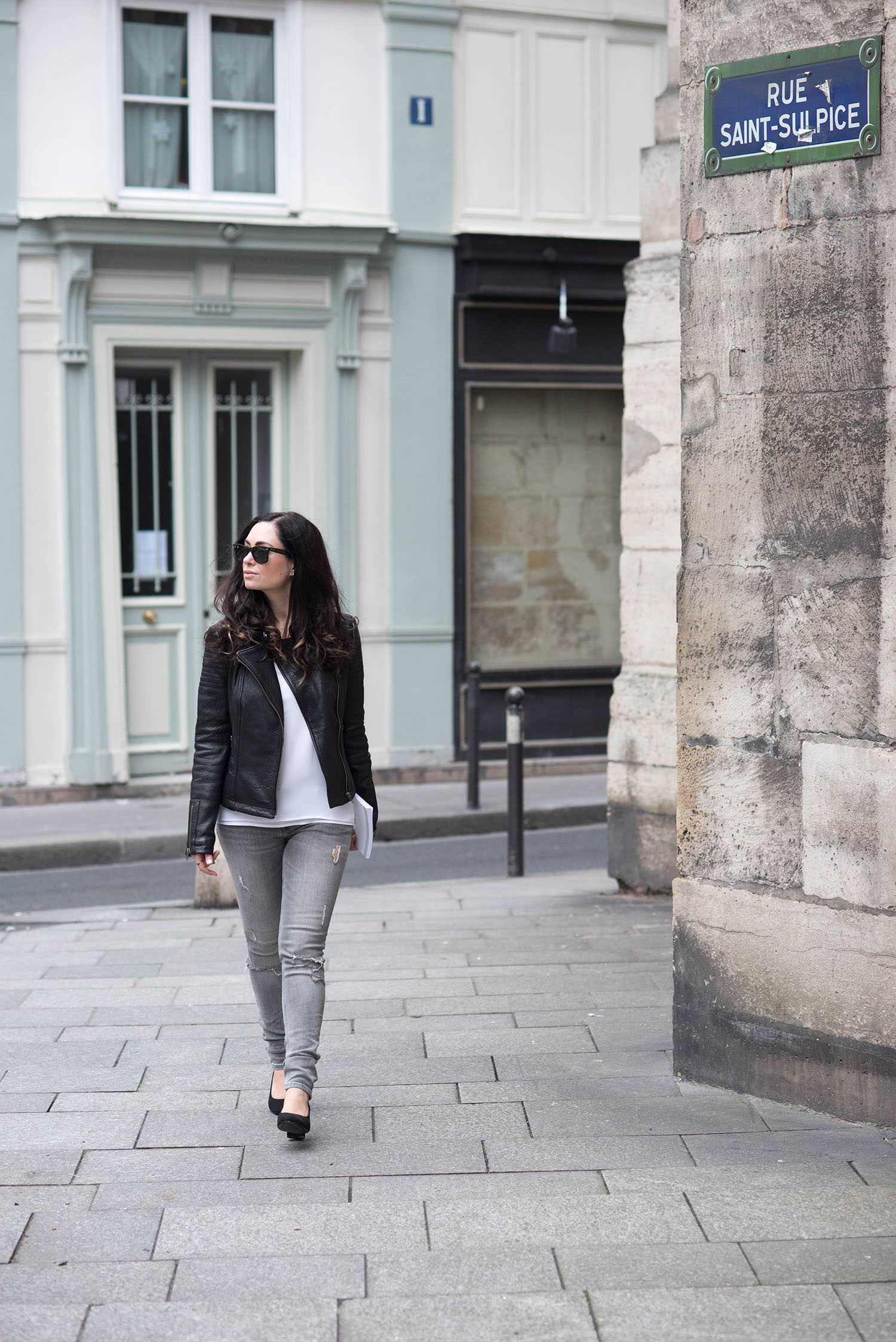 Fashion blogger Cee Fardoe of Coco & Vera wears Zara jeans and a leather jacket in Paris