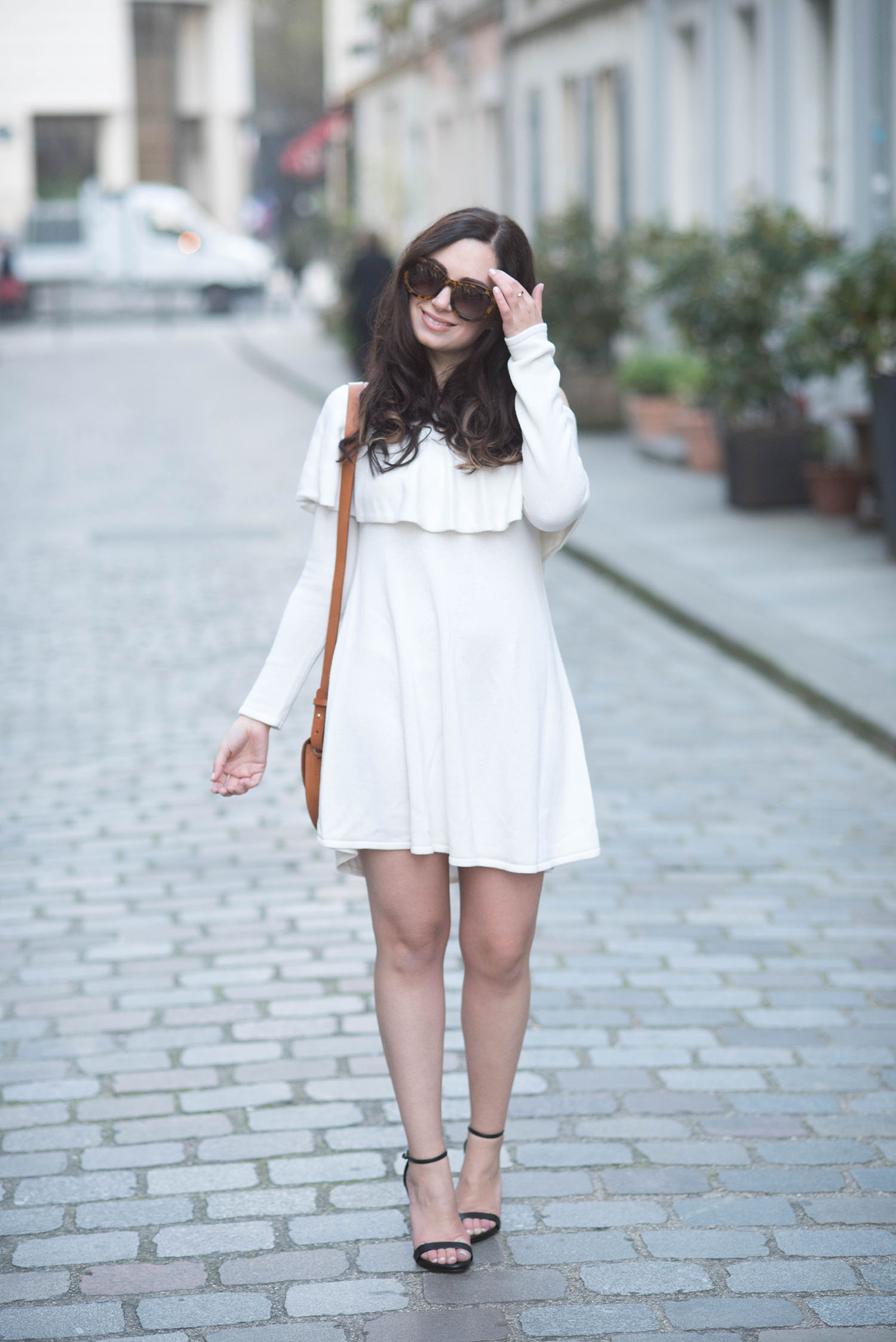 Style blogger Cee Fardoe of Coco & Vera wears an LPA off the shoulder dress on rue Cremieux in Paris