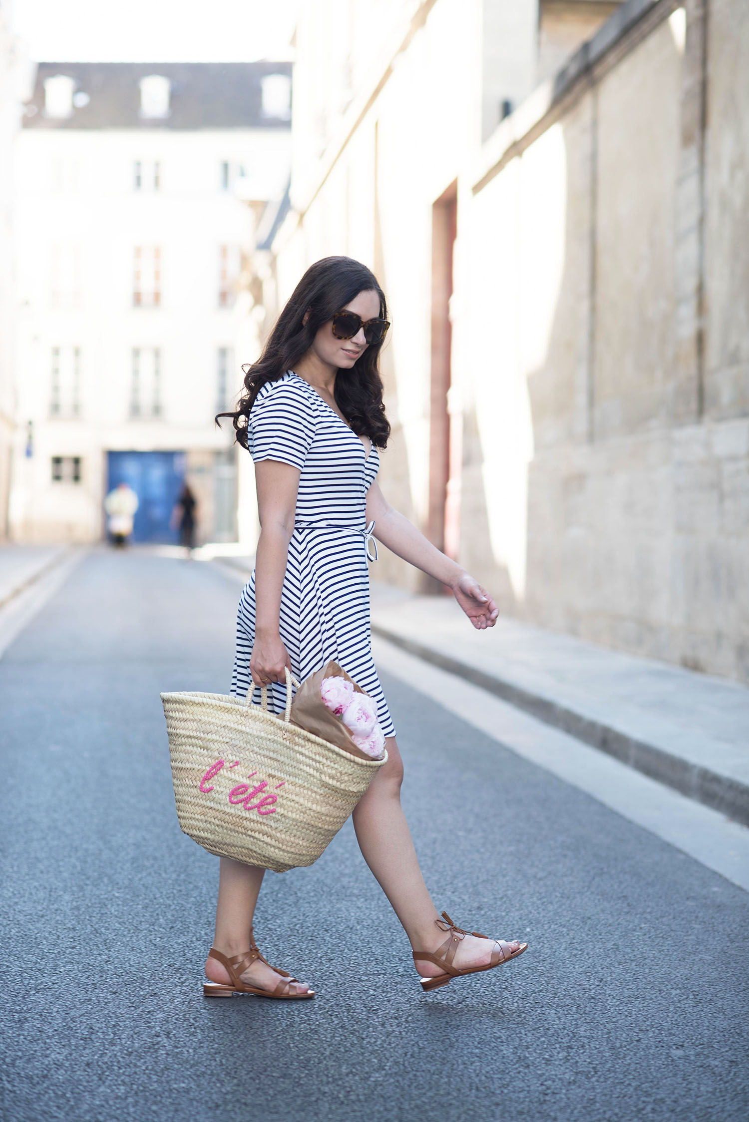 Style blogger Cee Fardoe of Coco & Vera walks in Paris wearing a striped Lovers + Friends dress
