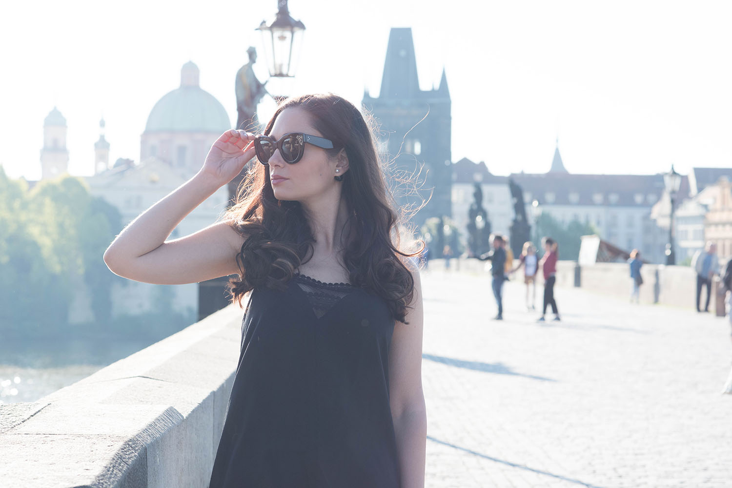 Fashion blogger Cee Fardoe of Coco & Vera on Charles Bridge in Prague wearing Celine Audrey sunglasses