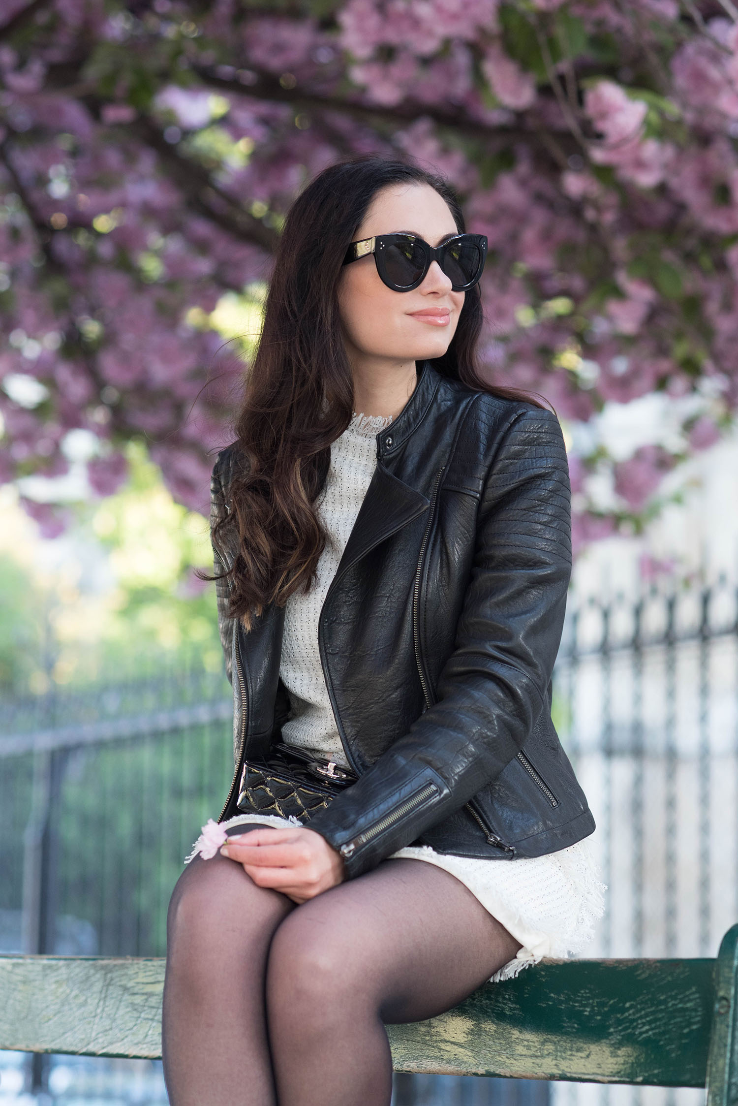 Portrait of style blogger Cee Fardoe of Coco & Vera, wearing a leather jacket and Celine sunglasses
