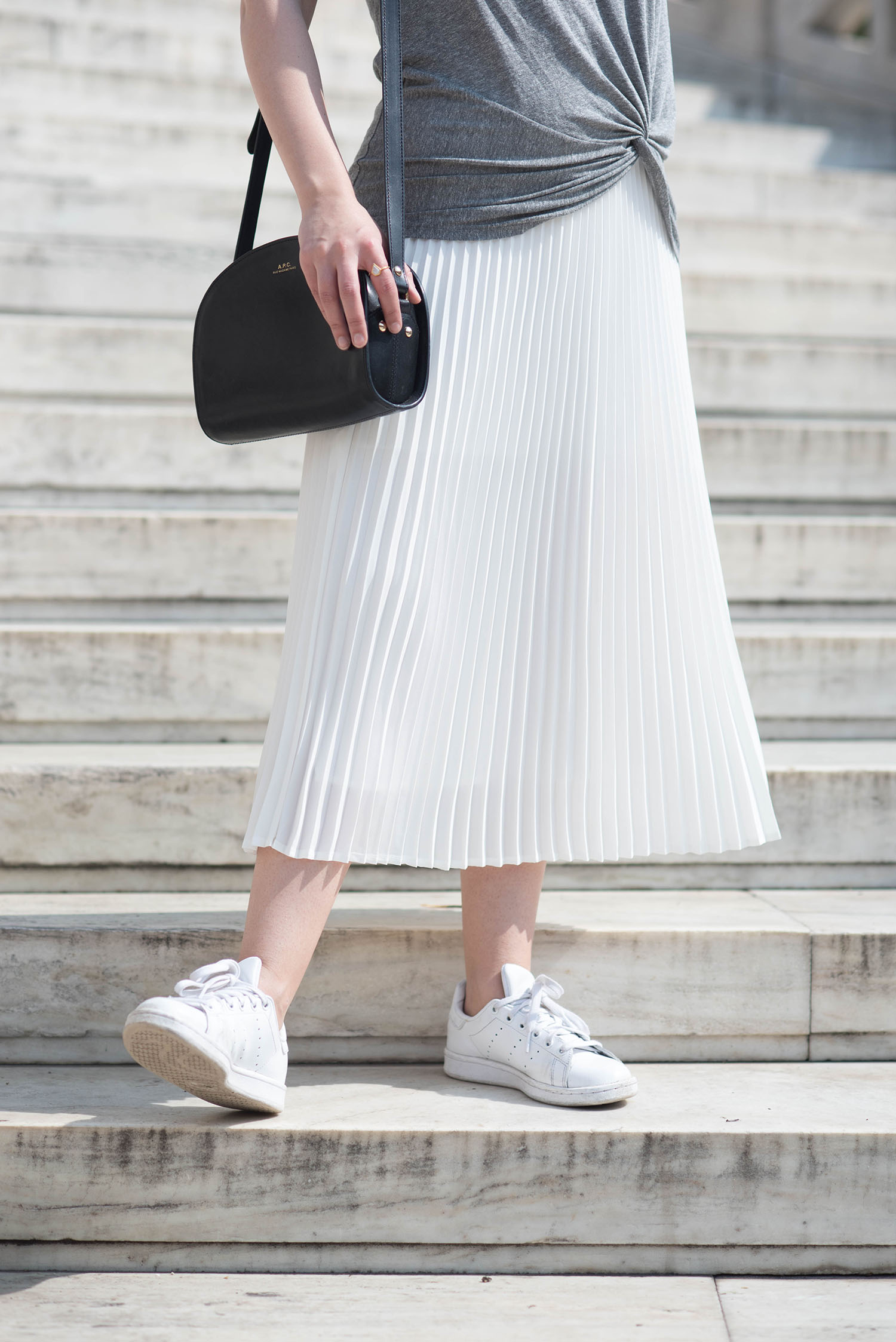 Outfit details on style blogger Cee Fardoe, including an APC halfmoon bag and Adidas Stan Smith sneakers