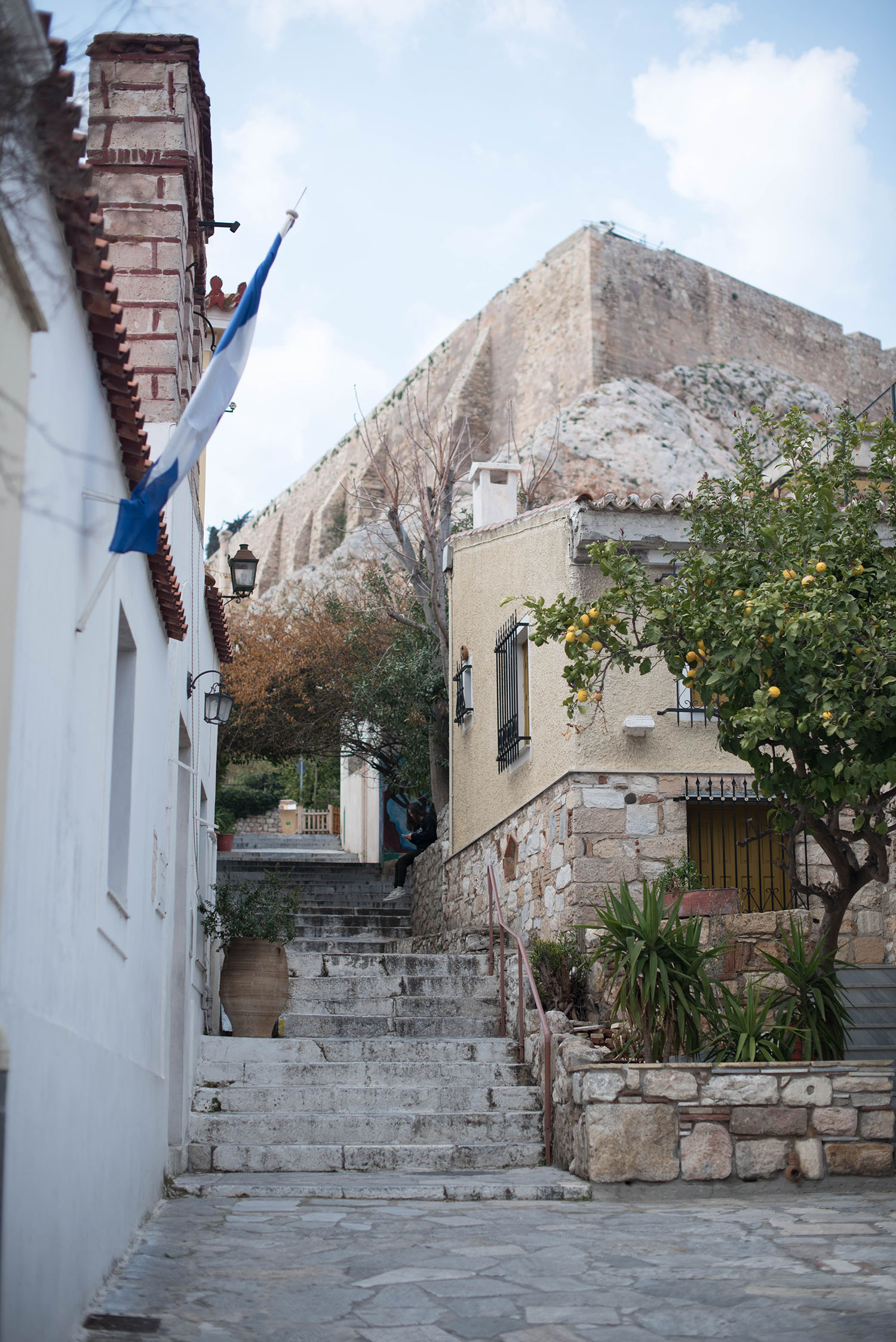 A small lane in the Plaka neighbourhood of Athens with a view of Acropolis Hill, photographed by Winnipeg travel blogger Cee Fardoe of Coco & Vera