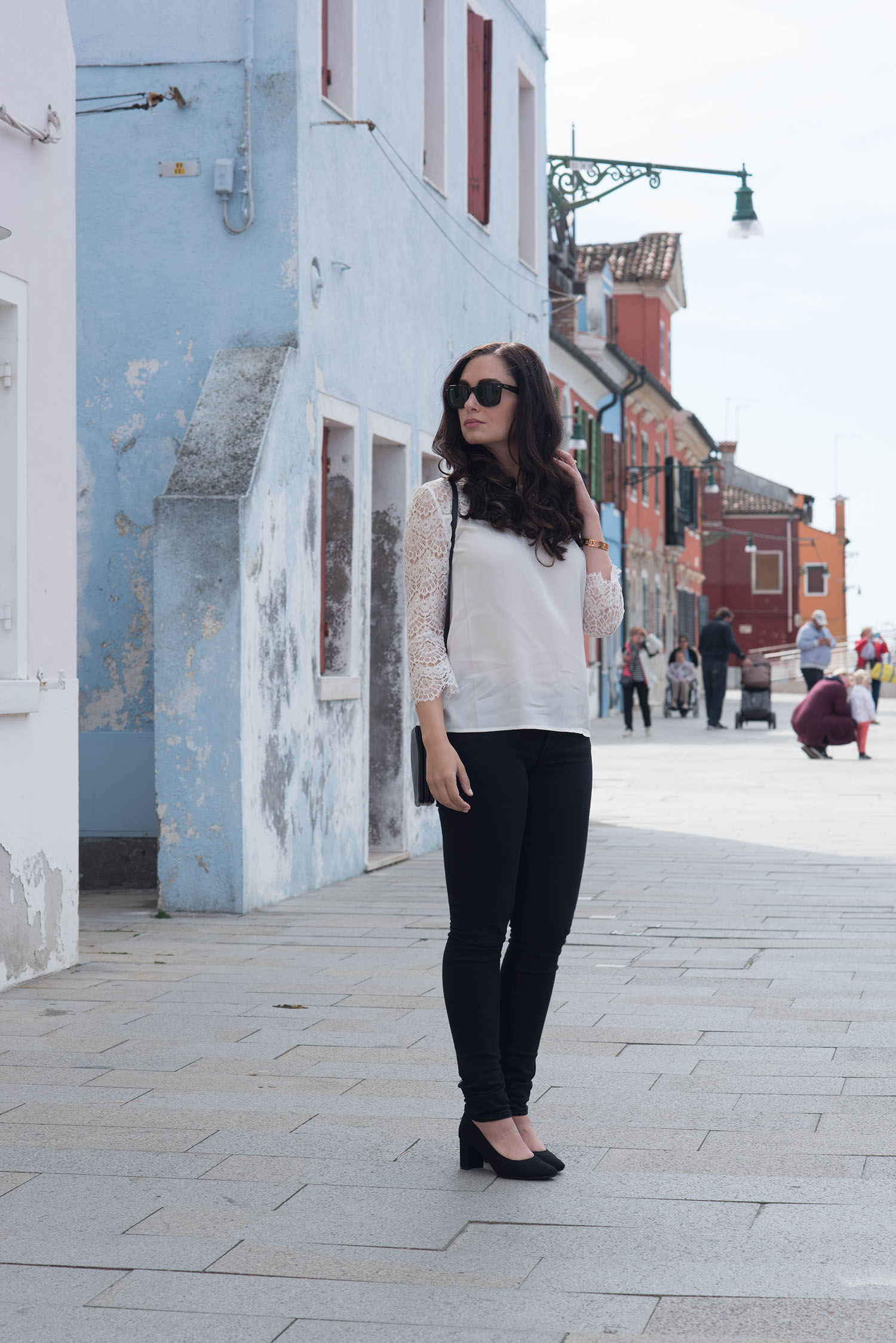 Style blogger Cee Fardoe of Coco & Vera visits Burano wearing Rayban Wayfarer sunglasses and a Sezane lace blouse