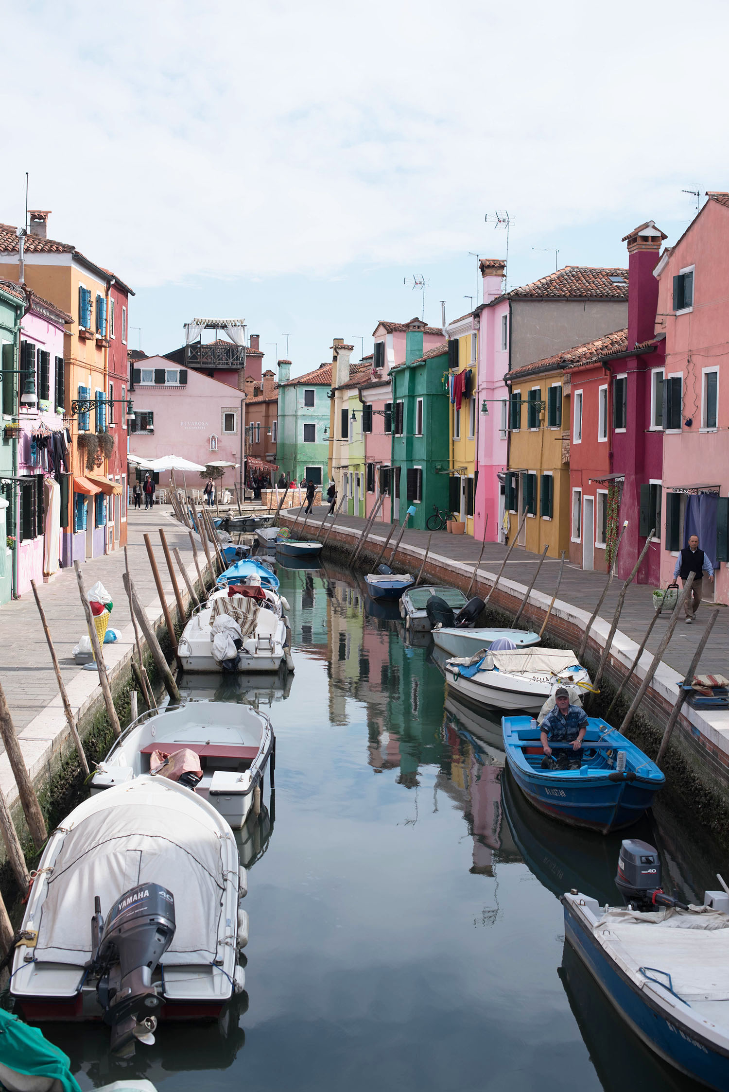 Colourful houses on either side of the canal in Burano, Italy, captured by travel blogger Cee Fardoe of Coco & vera