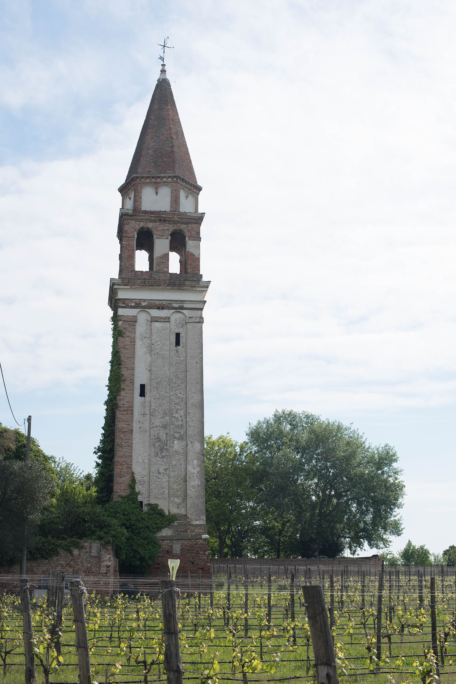 A stone tower at a winery on the island of Mazzorbo, Italy, captured by travel blogger Cee Fardoe of Coco & Vera