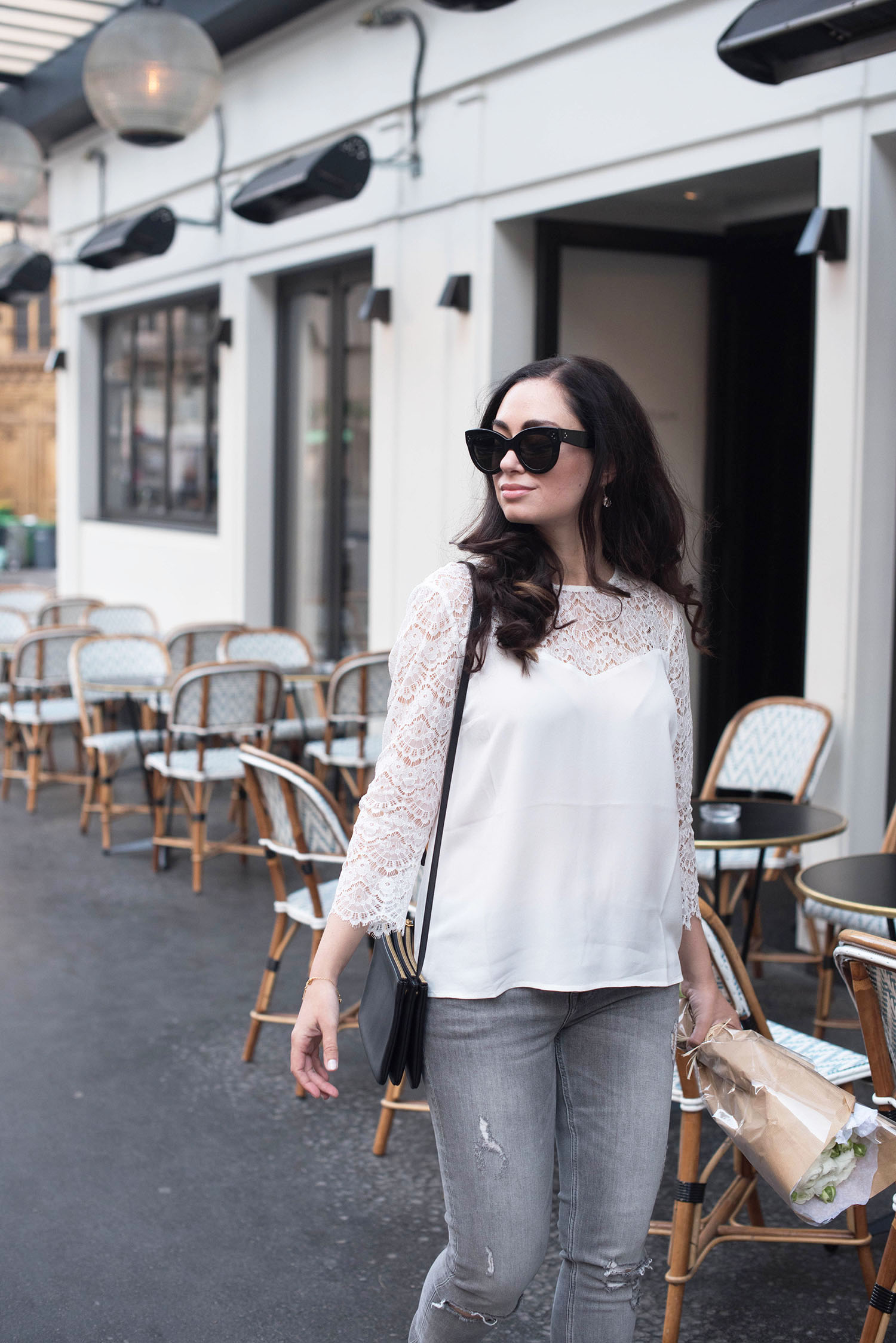 Style blogger Cee Fardoe of Coco & Vera walks past Maison Marie in Paris wearing Celine Audrey sunglasses and grey jeans