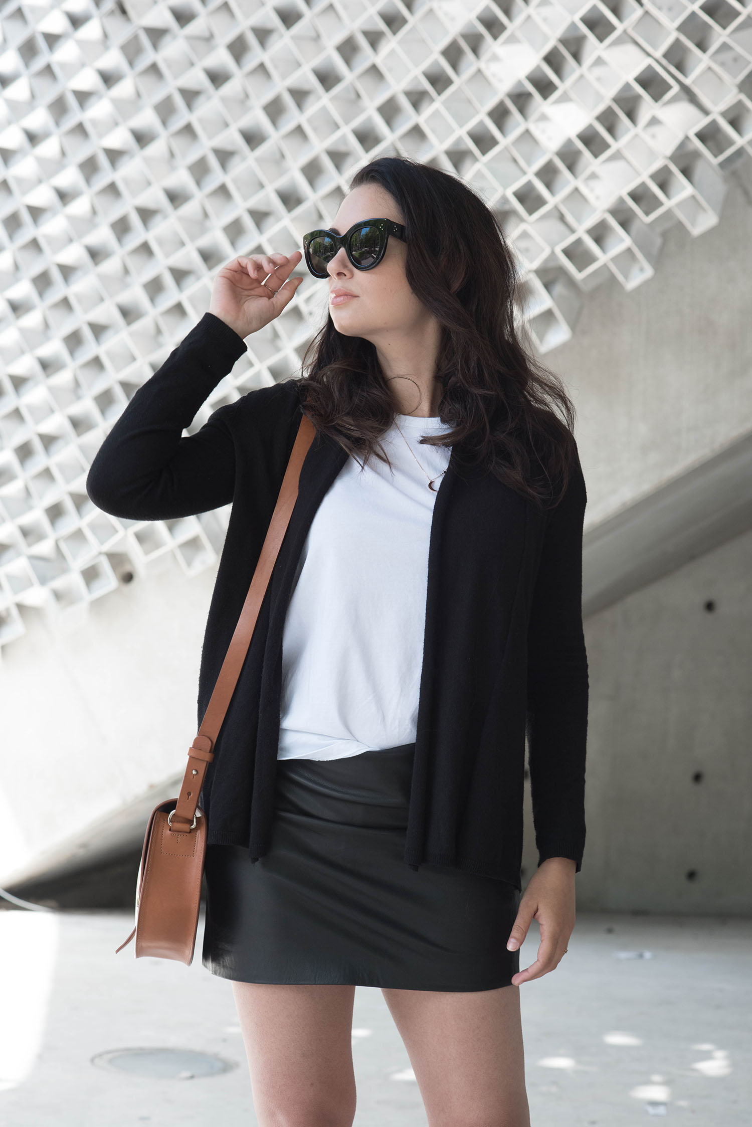 Portrait of brunette style blogger Cee Fardoe, wearing Celine Audrey sunglasses and a Maison Labiche tee