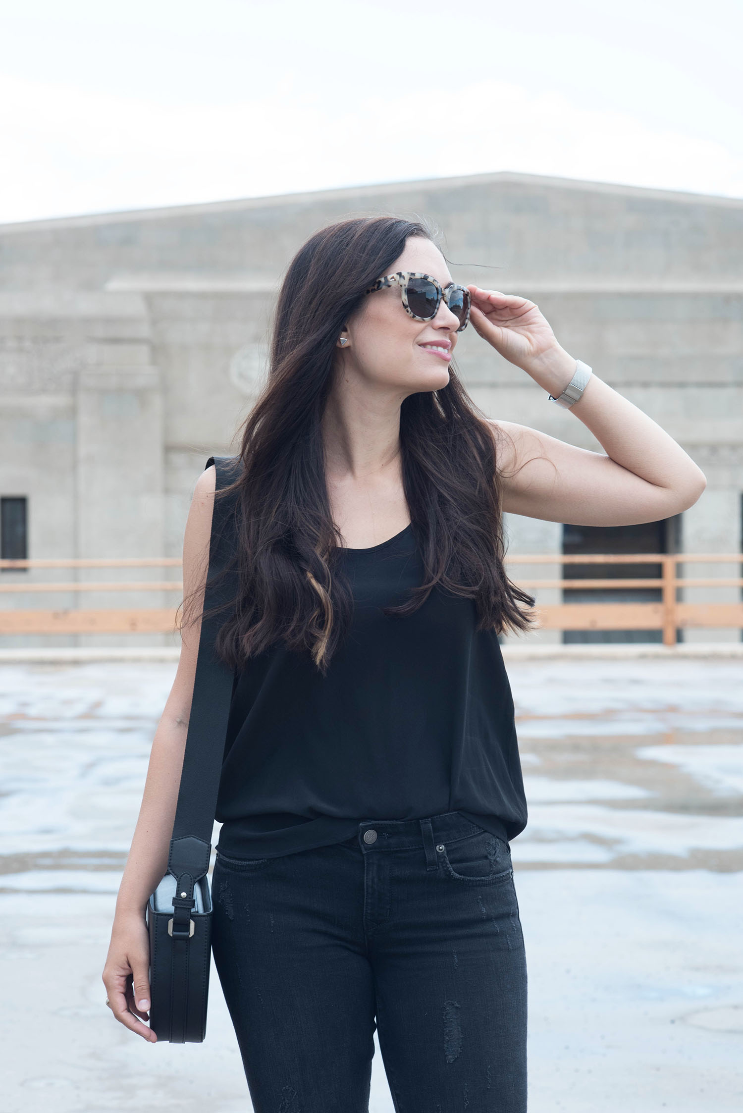 Portrait of Winnipeg fashion blogger Cee Fardoe wearing Ace & Tate sunglasses, a Rosefield watch and a Sezane black tank