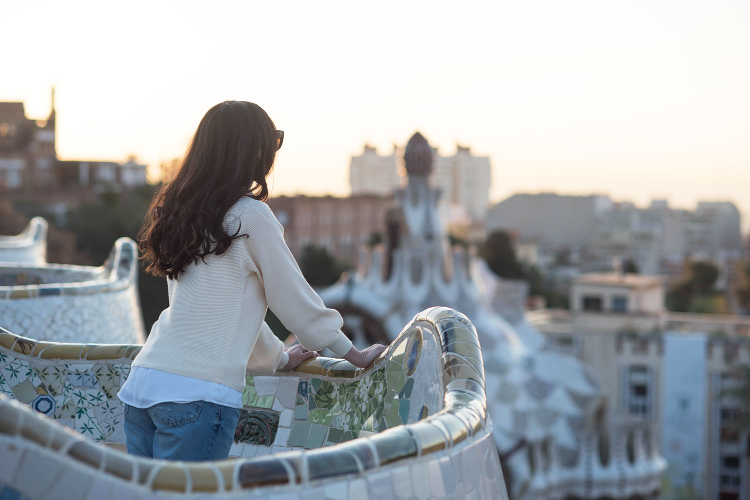 Portrait of fashion blogger Cee Fardoe of Coco & Vera looking out over Barcelona from Parc Guell