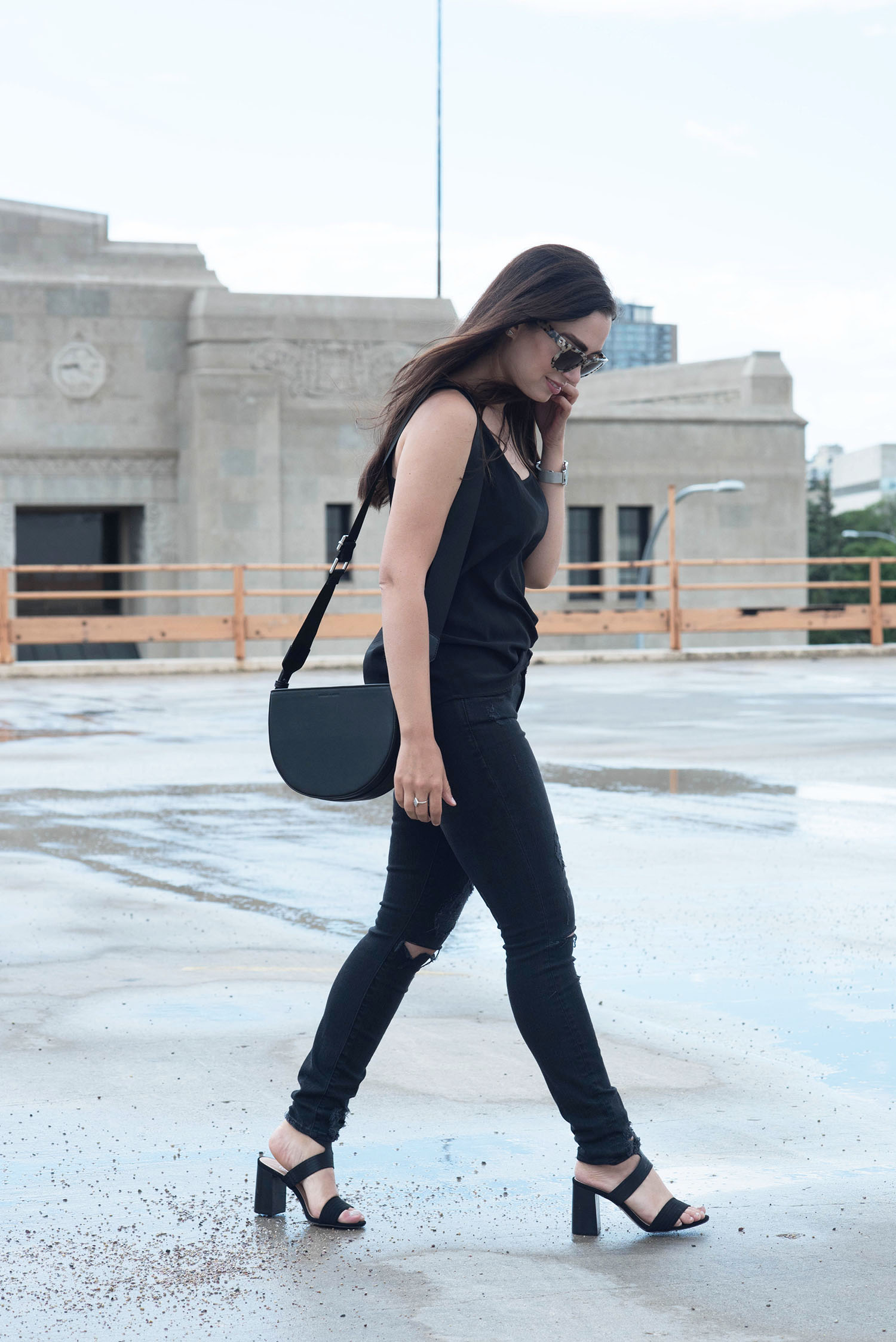 How to wear all black everything, as shown by fashion blogger Cee Fardoe of Coco & Vera, in Lovers + Friends jeans and a Sezane silk tank
