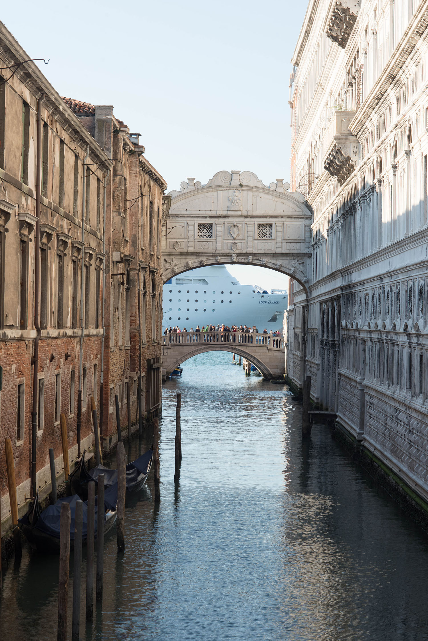Bridges over a Venetian canal behind St. Mark's Basilica in Italy, as captured by travel blogger Cee Fardoe of Coco & Vera