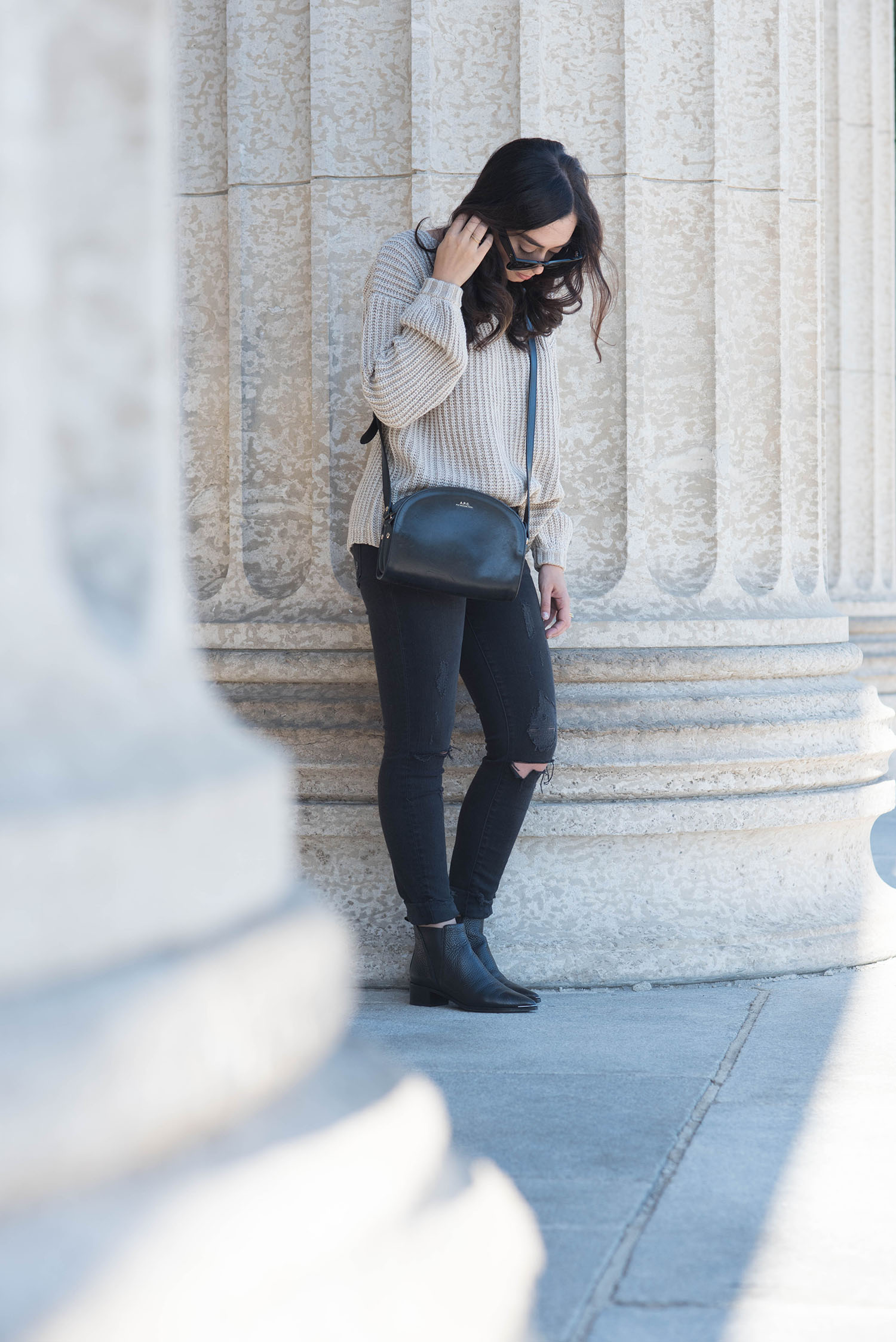 Fashion blogger Cee Fardoe of Coco & Vera wears a Tobi lace-up sweater, Acne Studios boots and APC halfmoon bag