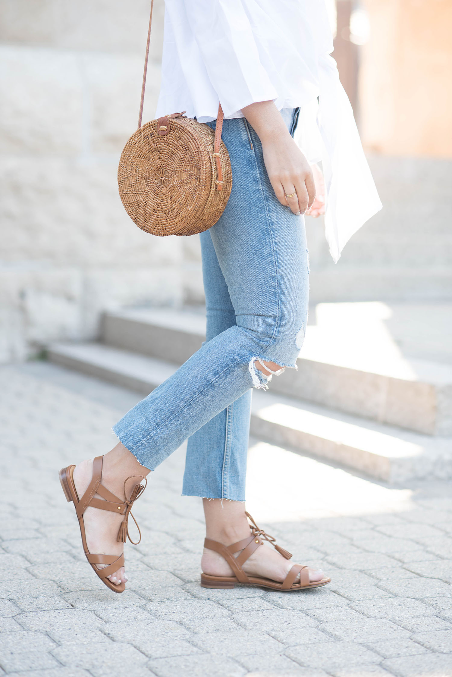 Outfit details on Winnipeg fashion blogger Cee Fardoe of Coco & Vera, including Sezane leather sandals, Grlfrnd Karolina blue jeans and an Ellen James rattan bag