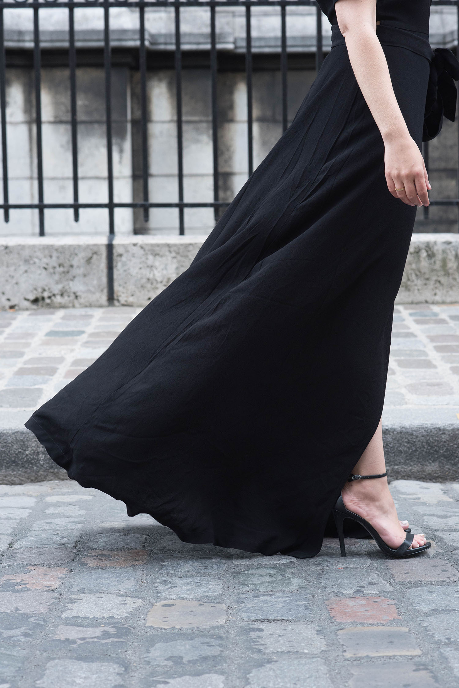 Outfit details on fashion blogger Cee Fardoe of Coco & Vera, including and Ivy & Oak black maxi dress and Steve Madden Stecy sandals
