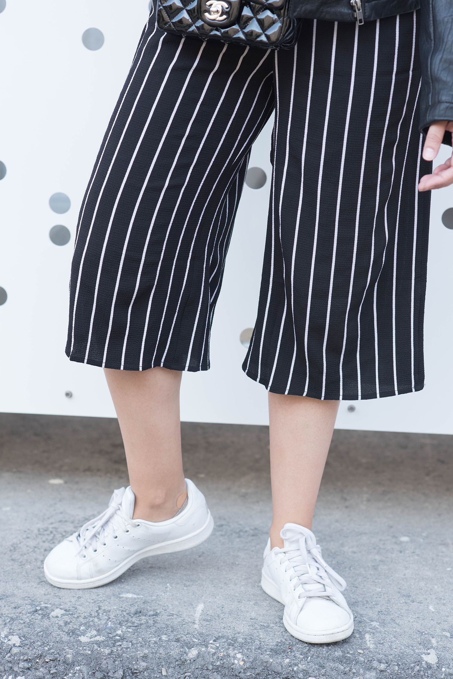 Outfit details on Winnipeg fashion blogger Cee Fardoe of Coco & Vera, wearing a Missy Empire striped jumpsuit, Adidas Stan Smith sneakers and black Chanel extra mini handbag