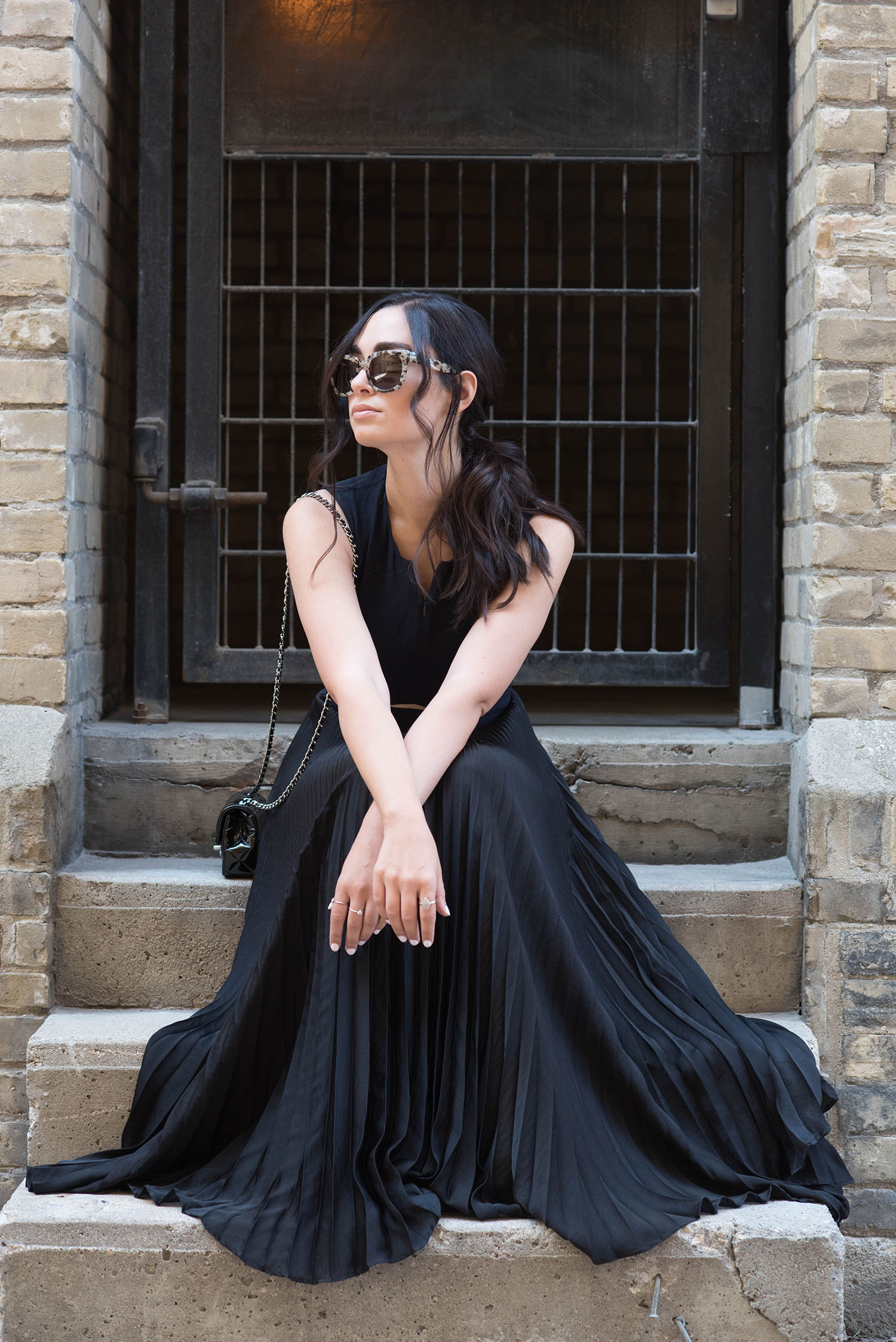 Winnipeg fashion blogger Cee Fardoe of Coco & Vera wears an ALC gown and a ponytail styled by Fran Rizzutto, while carrying a Chanel extra mini handbag