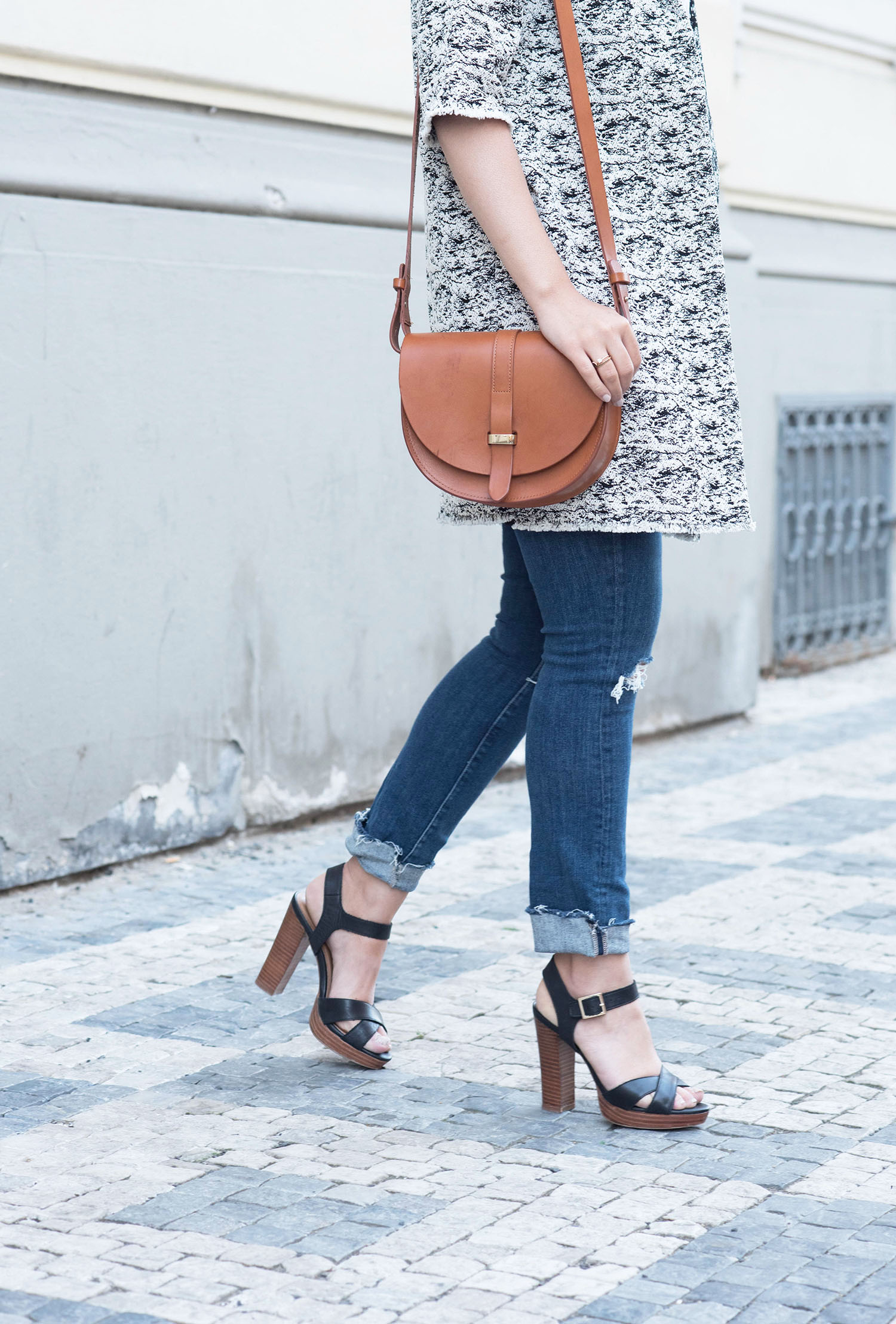Outfit details on fashion blogger Cee Fardoe of Coco & Vera, including a Sezane Claude bag, Paige jeans and Le Chateau sandals