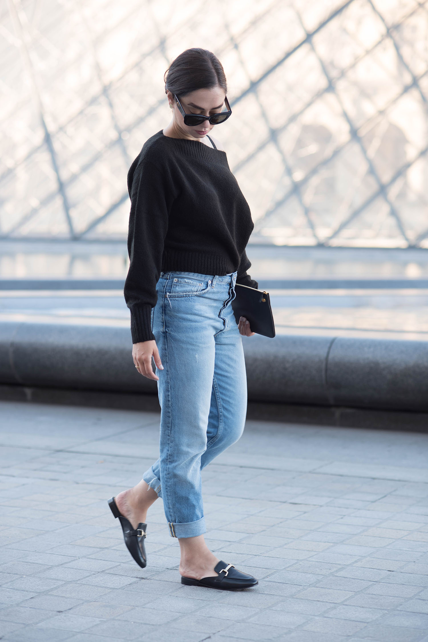 Fashion blogger Cee Fardoe of Coco & Vera stands outside the Louvre in Paris wearing Jonak mules and Zara boyfriend jeans