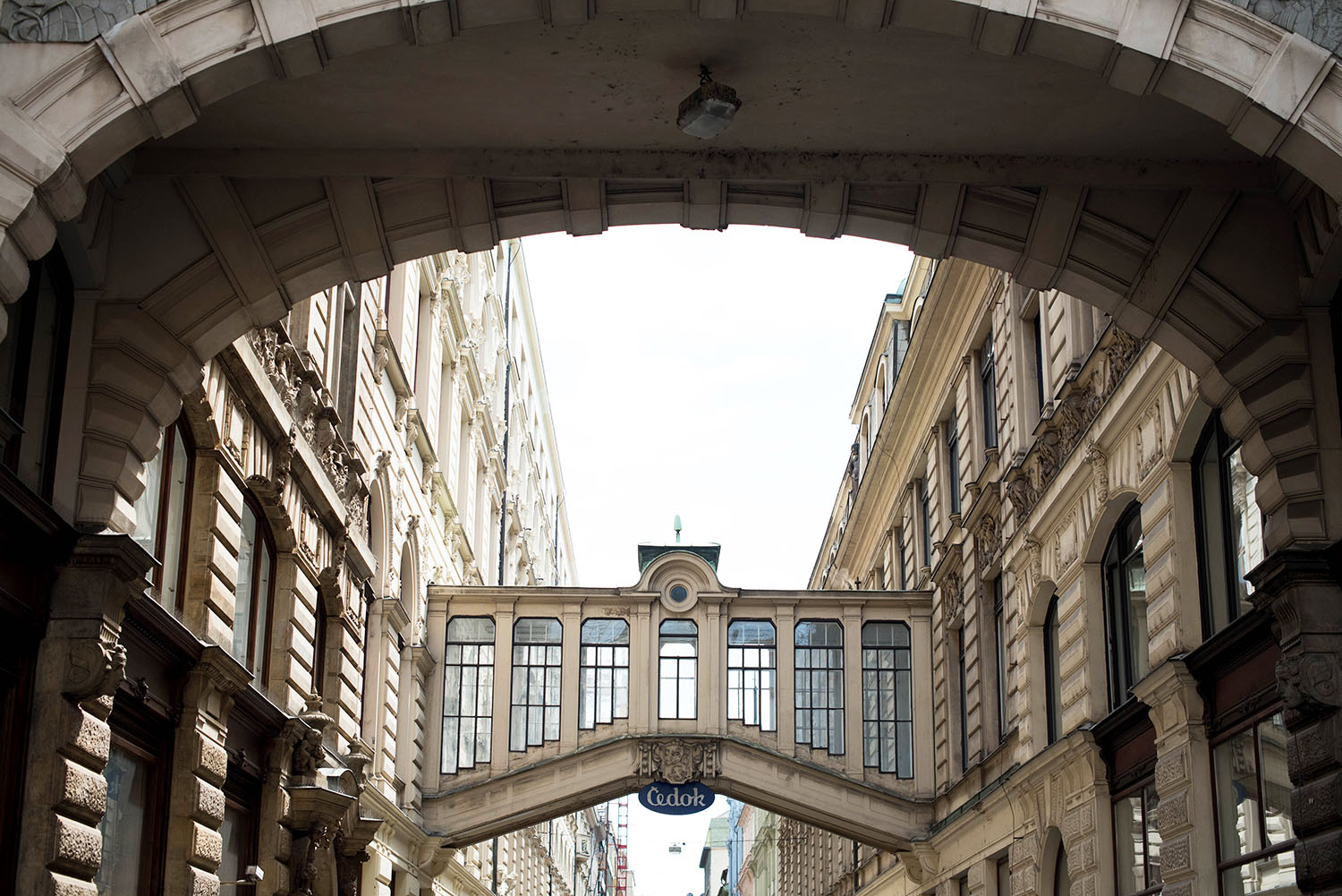 A glass walkway between buildings in the Old Town in Prague, as photographed by travel blogger Cee Fardoe of Coco & Vera
