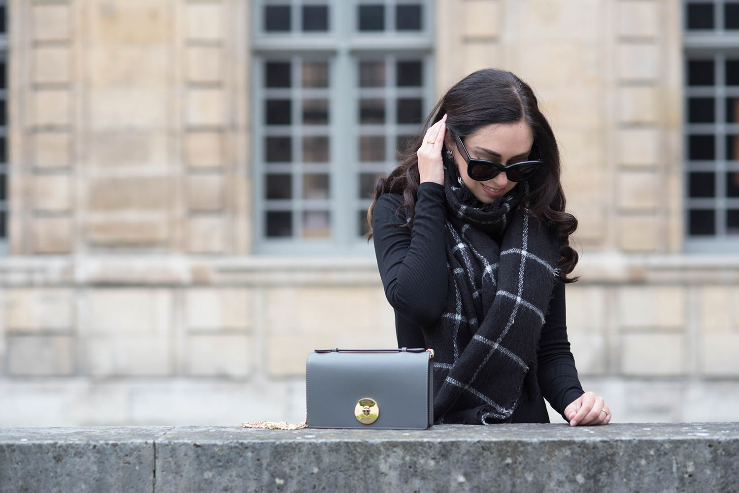 Portrait of Winnipeg fashion blogger Cee Fardoe at the Hotel de Sully in Paris wearing Celine Audrey sunglasses and a Zara checked scarf