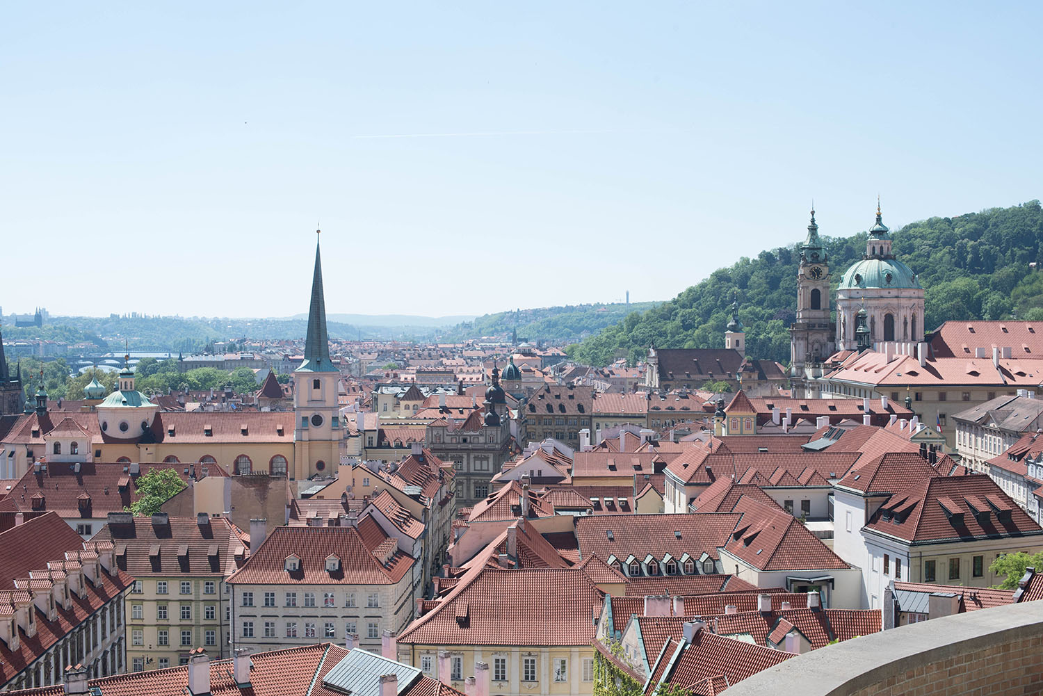 A view of the red rooftops of Prague, taken from Prague Castle by travel blogger Cee Fardoe of Coco & Vera