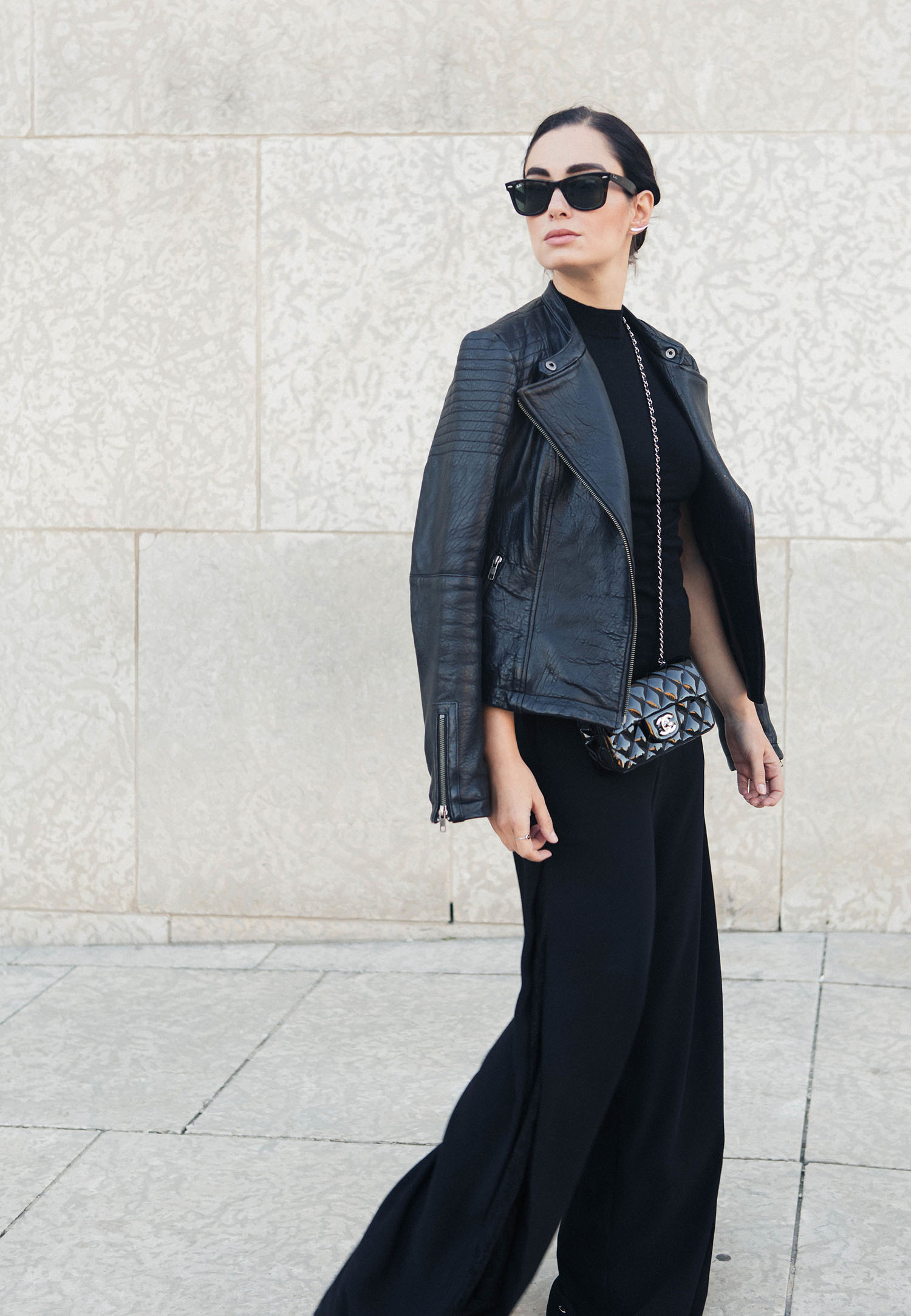 Fashion blogger Cee Fardoe of Coco & Vera wears all black at the Winnipeg Art Gallery, including RayBan Wayfarer sunglasses and a Le Chateau sweater, captured by Christa Wong Photography