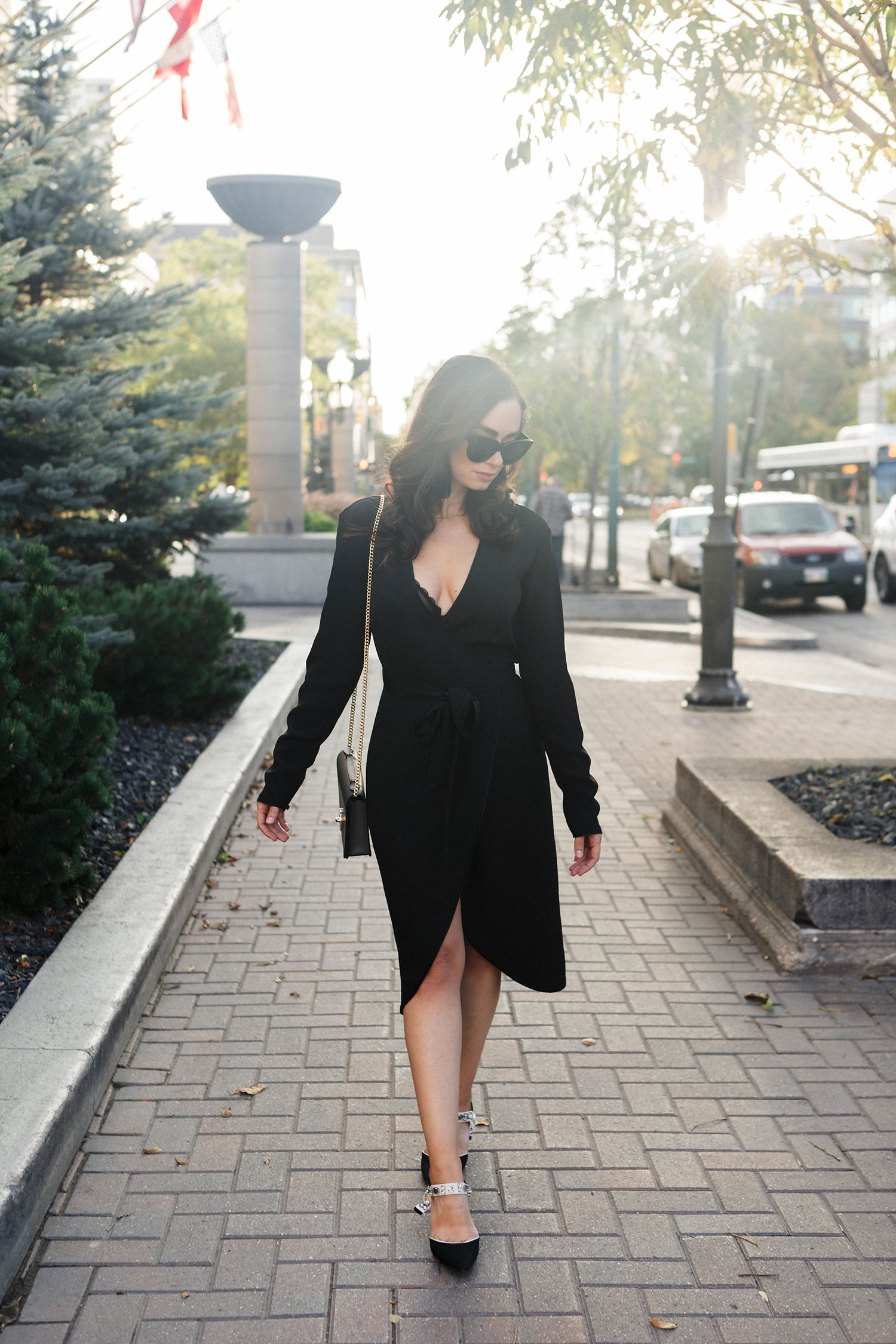 Fashion blogger Cee Fardoe of Coco & Vera walks in front of the Fort Garry Hotel in Winnipeg, wears a Rodarte x & Other Stories dress, as captured by Christa Wong Photography