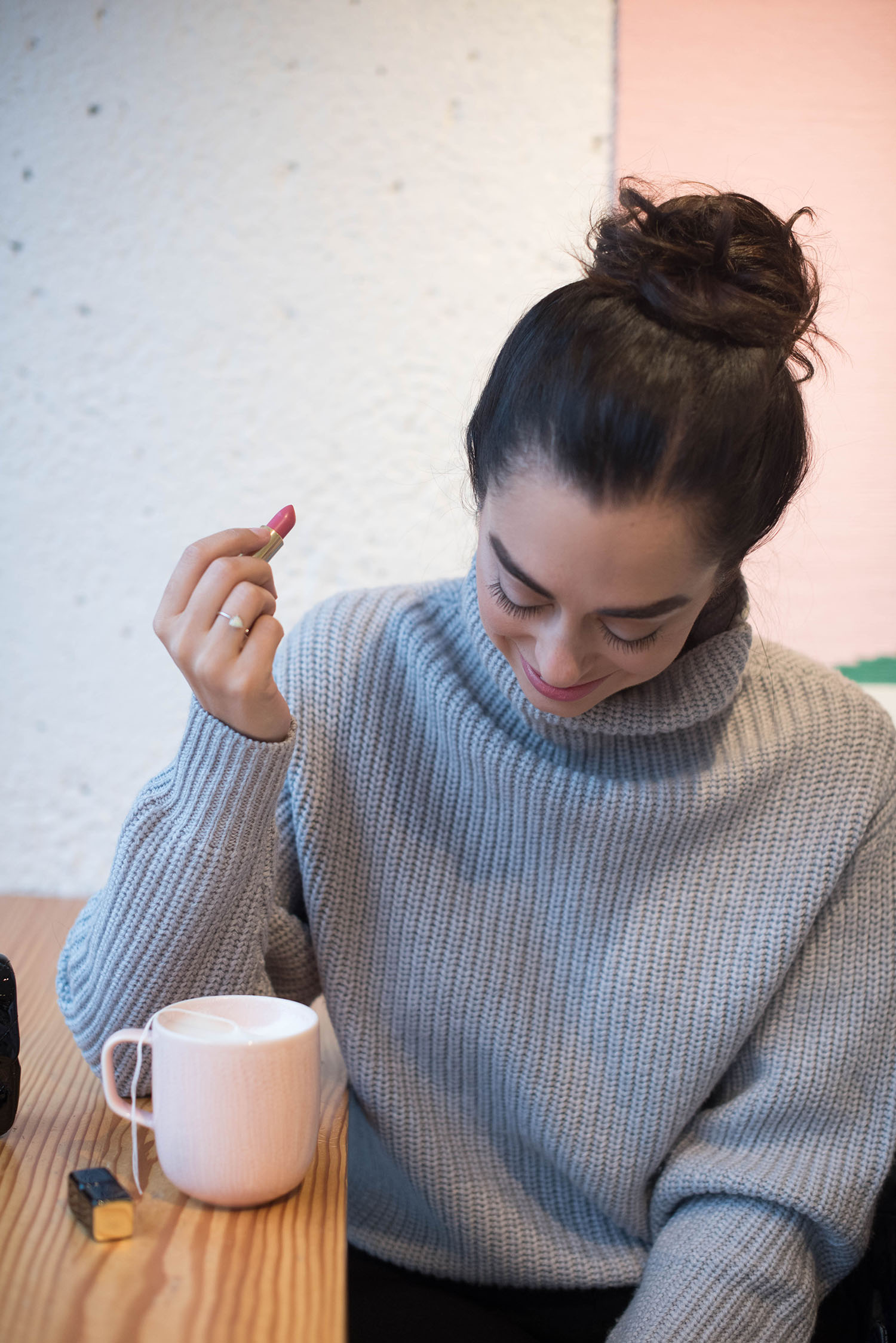 Portrait of Winnipeg fashion blogger Cee Fardoe of Coco & Vera, enjoying a chai latte at Little Sister Coffee