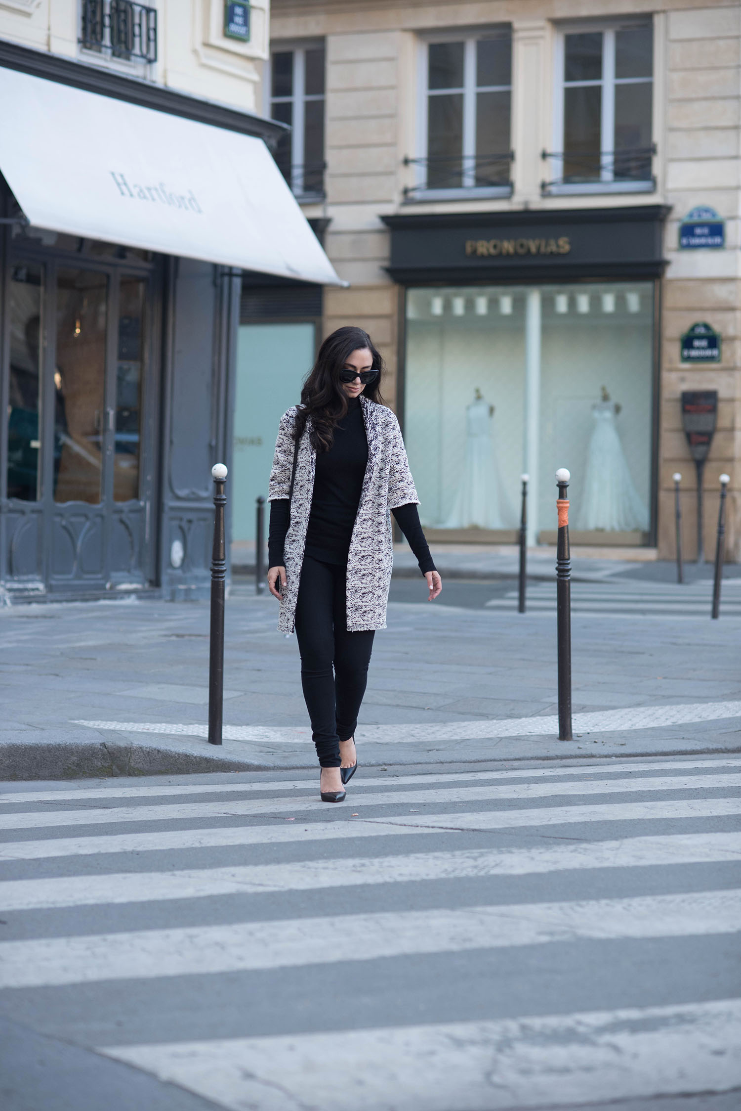 Fashion blogger Cee Fardoe of Coco & Vera wearing a Floriane Fosso coat and Christian Louboutin Pigalle pumps in Paris