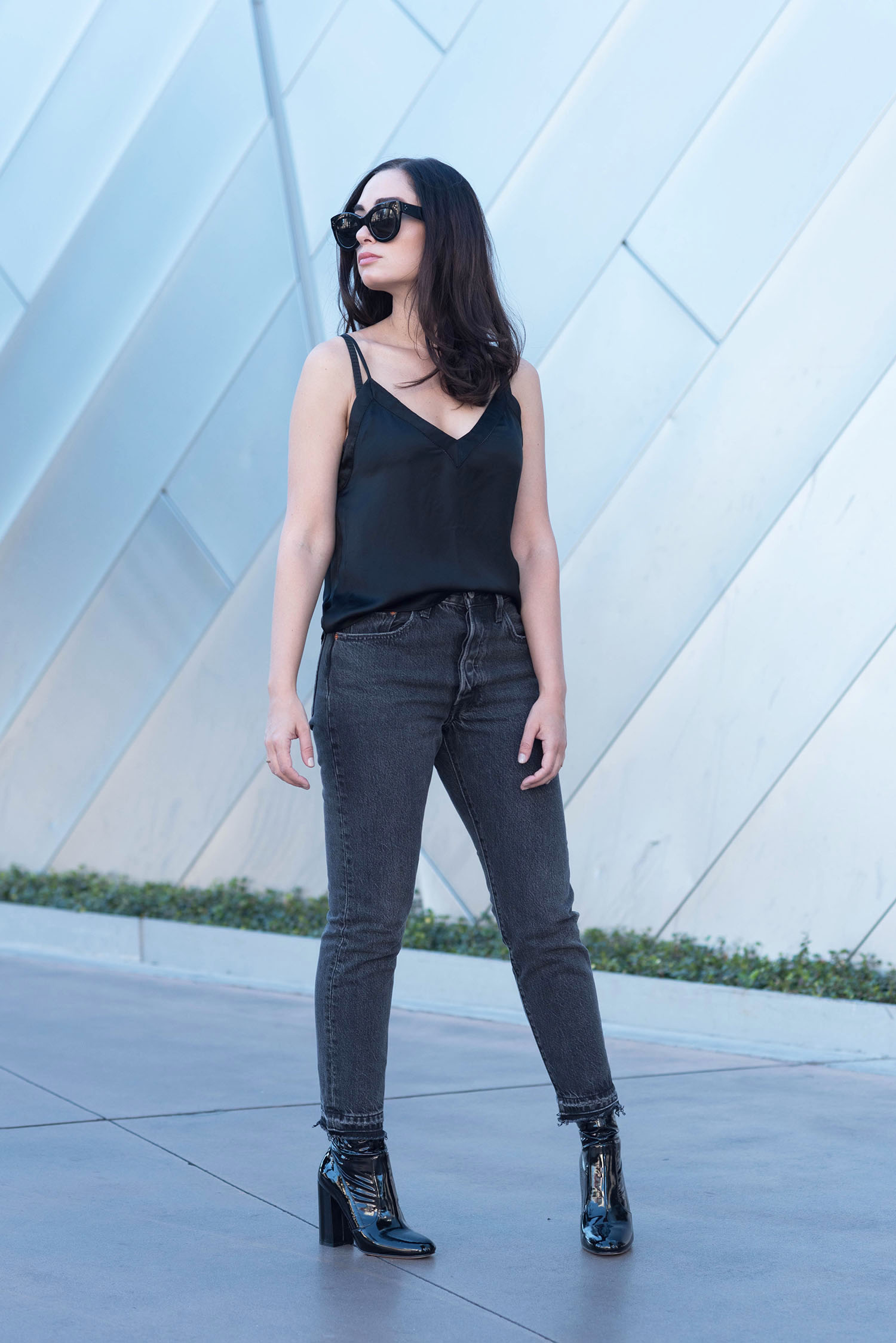 Winnipeg fashion blogger Cee Fardoe of Coco & Vera in Las Vegas wearing an Aritzia black silk tank and Levis 501 skinny jeans