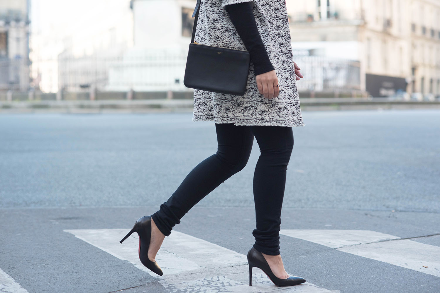 Outfit details on fashion blogger Cee Fardoe of Coco & Vera, including a Celine trio bag and black Mavi skinny jeans
