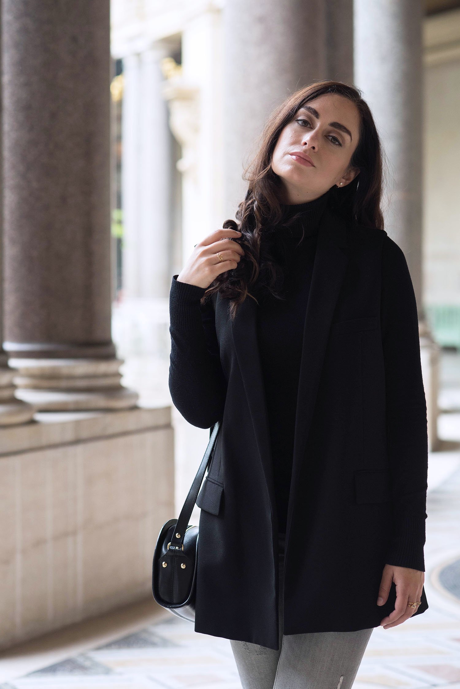 Portrait of Winnipeg fashion blogger Cee Fardoe of Coco & Vera at the Petit Palais in Paris wearing a black Zara vest and carrying and APC halfmoon bag