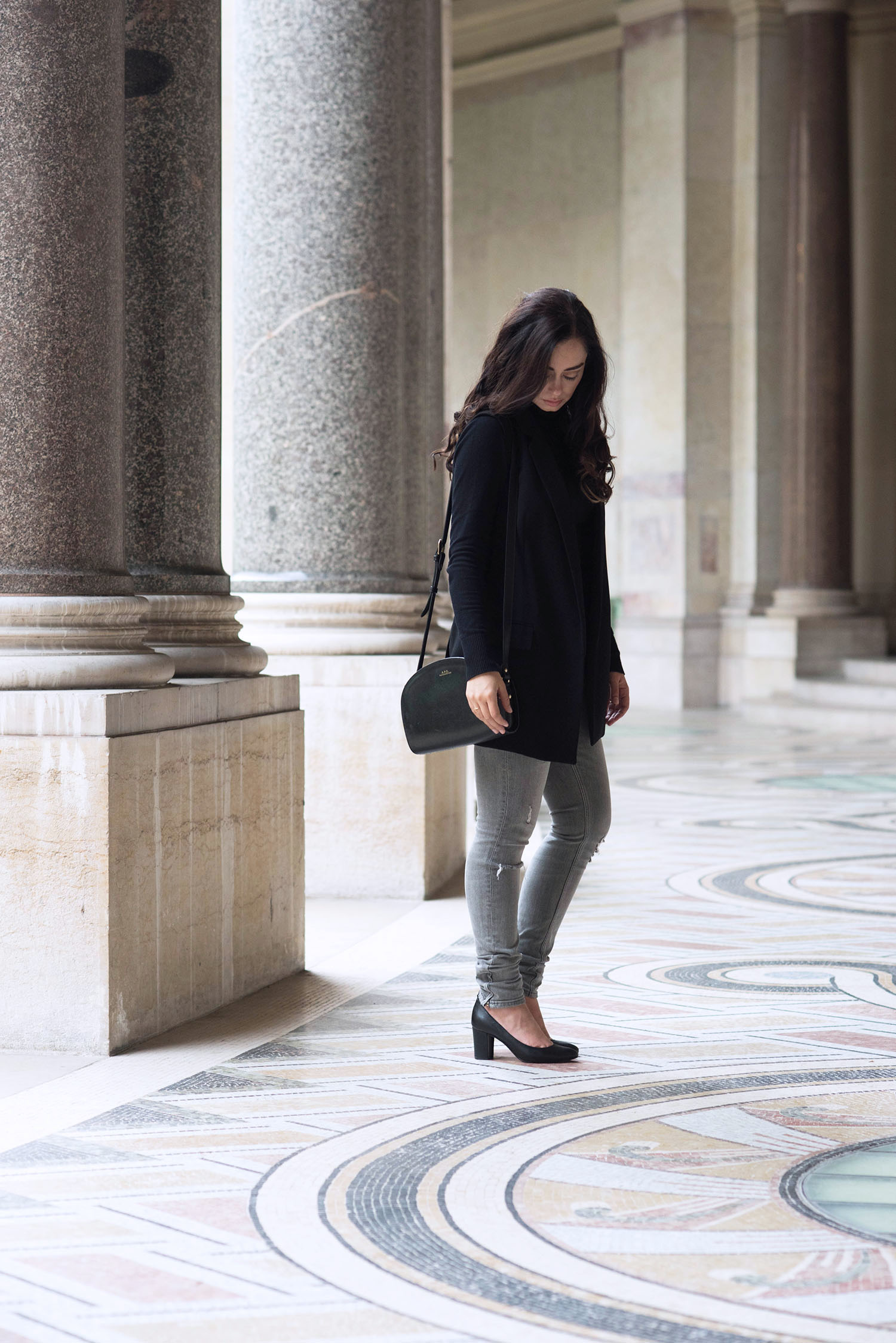 Fashion blogger Cee Fardoe of Coco & Vera stands in the Petit Palais in Paris wearing Raye the Label block heels and Zara grey jeans