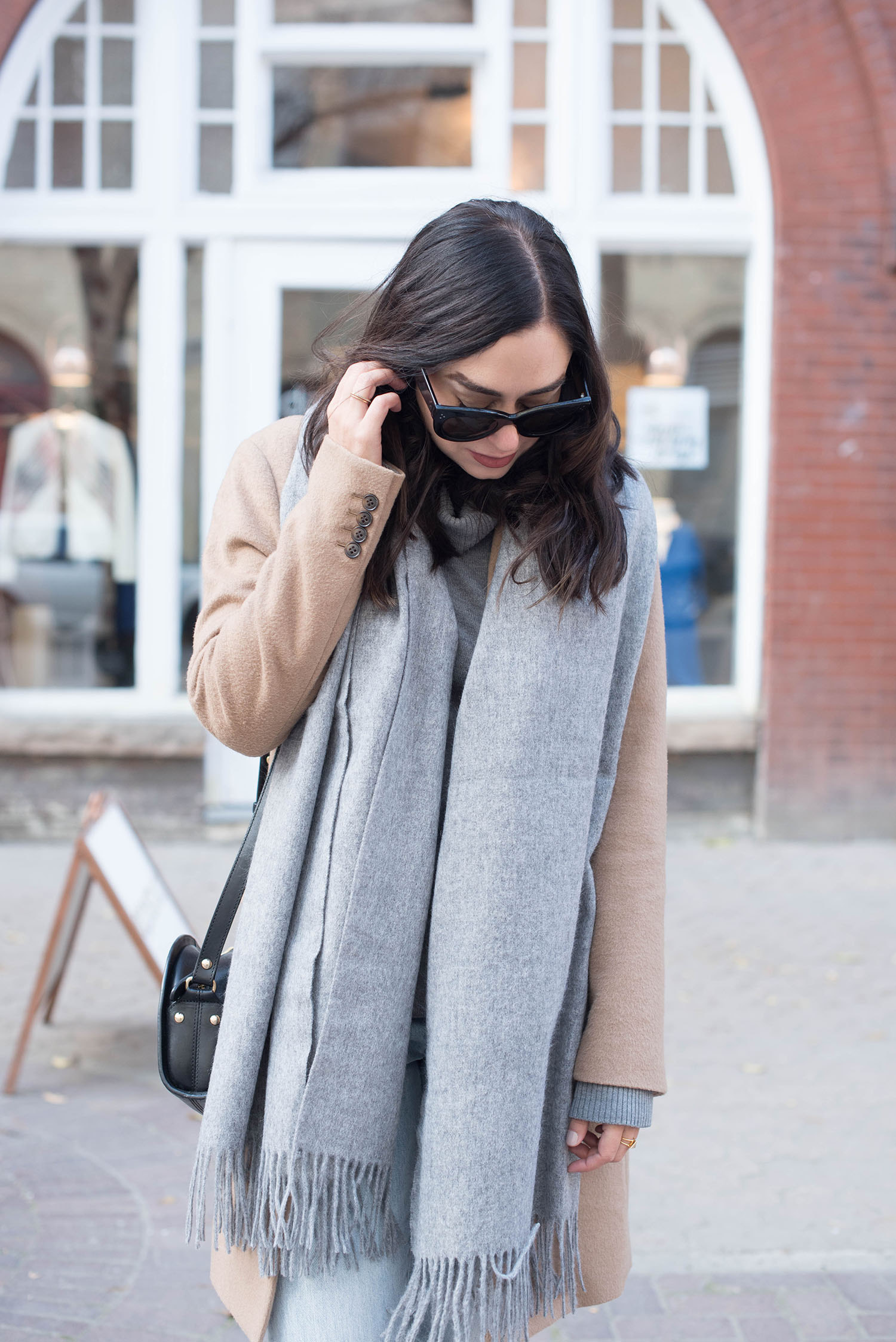 Portrait of fashion blogger Cee Fardoe of Coco & Vera wearing an ASOS wool scarf and Celine Audrey sunglasses