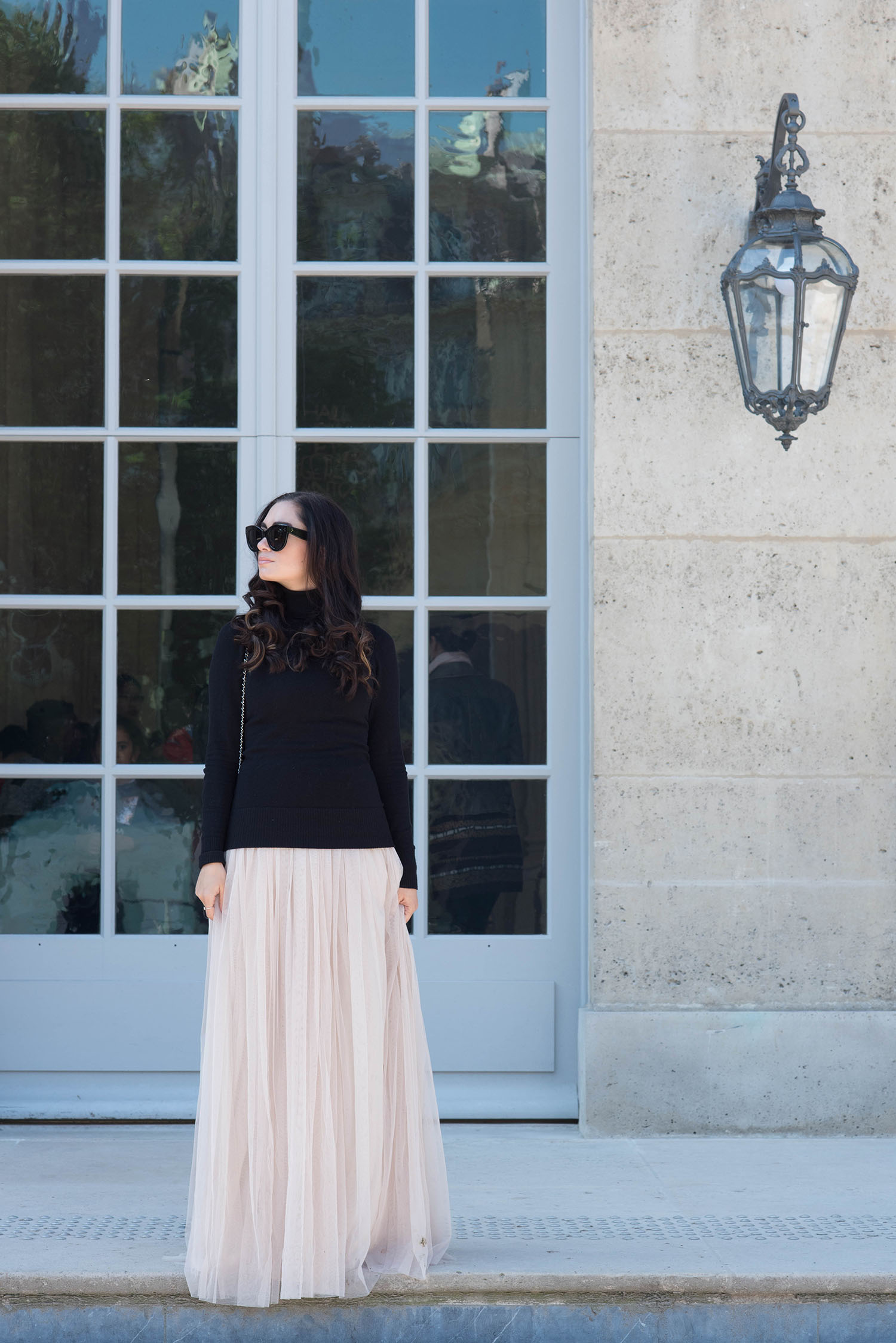 Fashion blogger Cee Fardoe of Coco & Vera stands outside the Musee Rodin in Paris wearing a Needle and Thread dress and Celine Audrey sunglasses