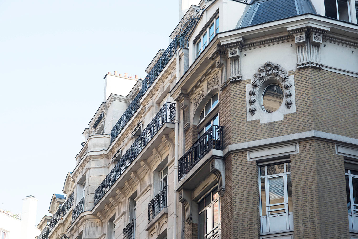A brown and cream brick building in Paris, as photographed by top Canadian travel blogger Cee Fardoe of Coco & Vera