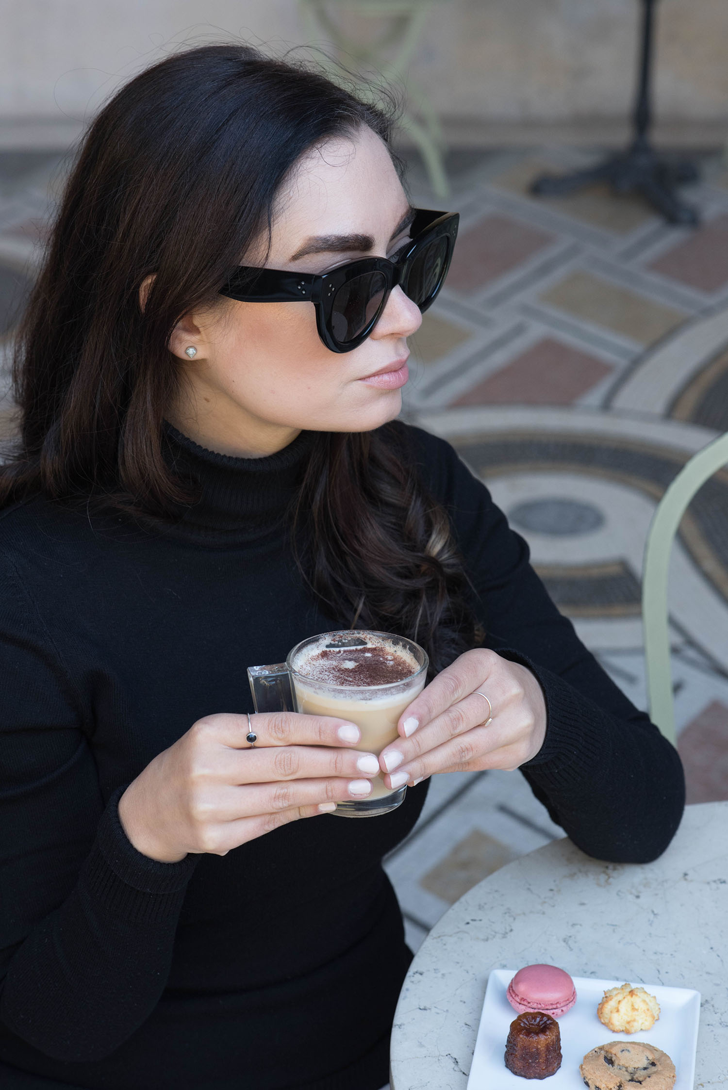 Portrait of Canadian fashion blogger Cee Fardoe of Coco & Vera drinking coffee at the Petit Palais in Paris while wearing Celine Audrey sunglasses
