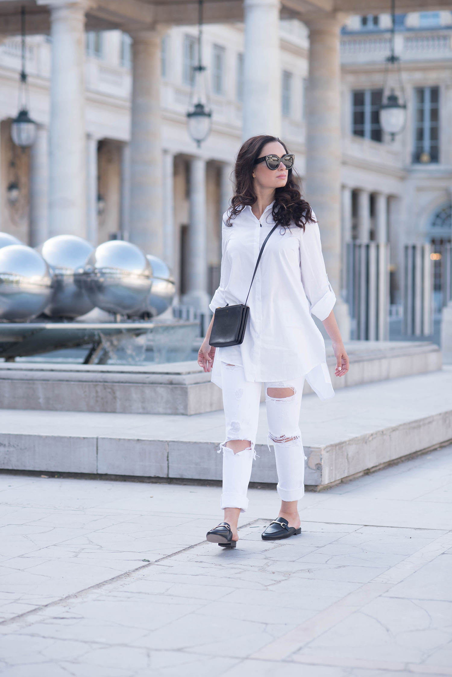 Fashion blogger Cee Fardoe of Coco & Vera at the Palais Royal in Paris, wearing Celine Audrey sunglasses and Grlfrnd Karolina white jeans