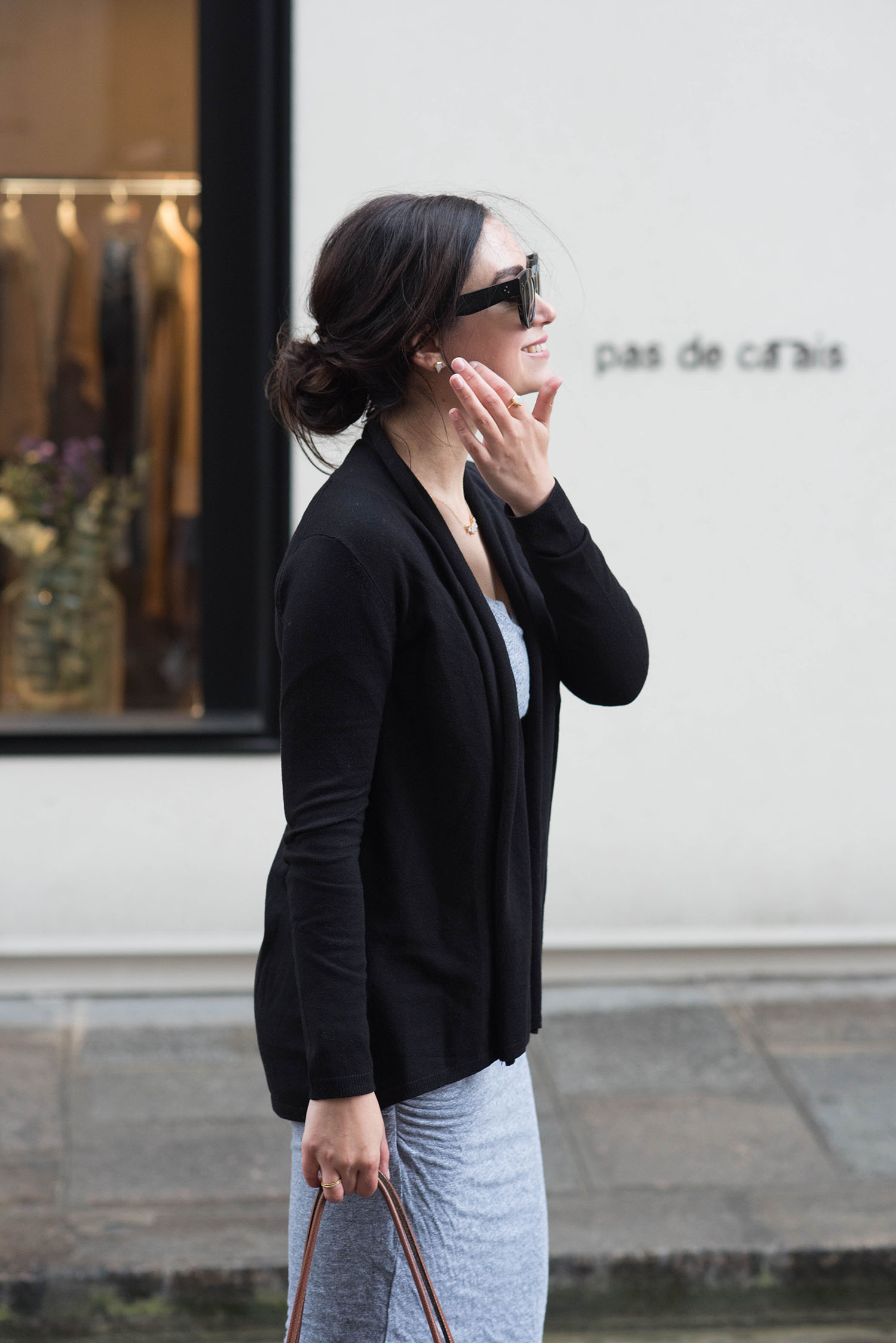 Portrait of Canadian fashion blogger Cee Fardoe of Coco & Vera outside Pas de Calais in Paris, wearing Celine Audrey sunglasses and a Leah Alexandra moonstone ring