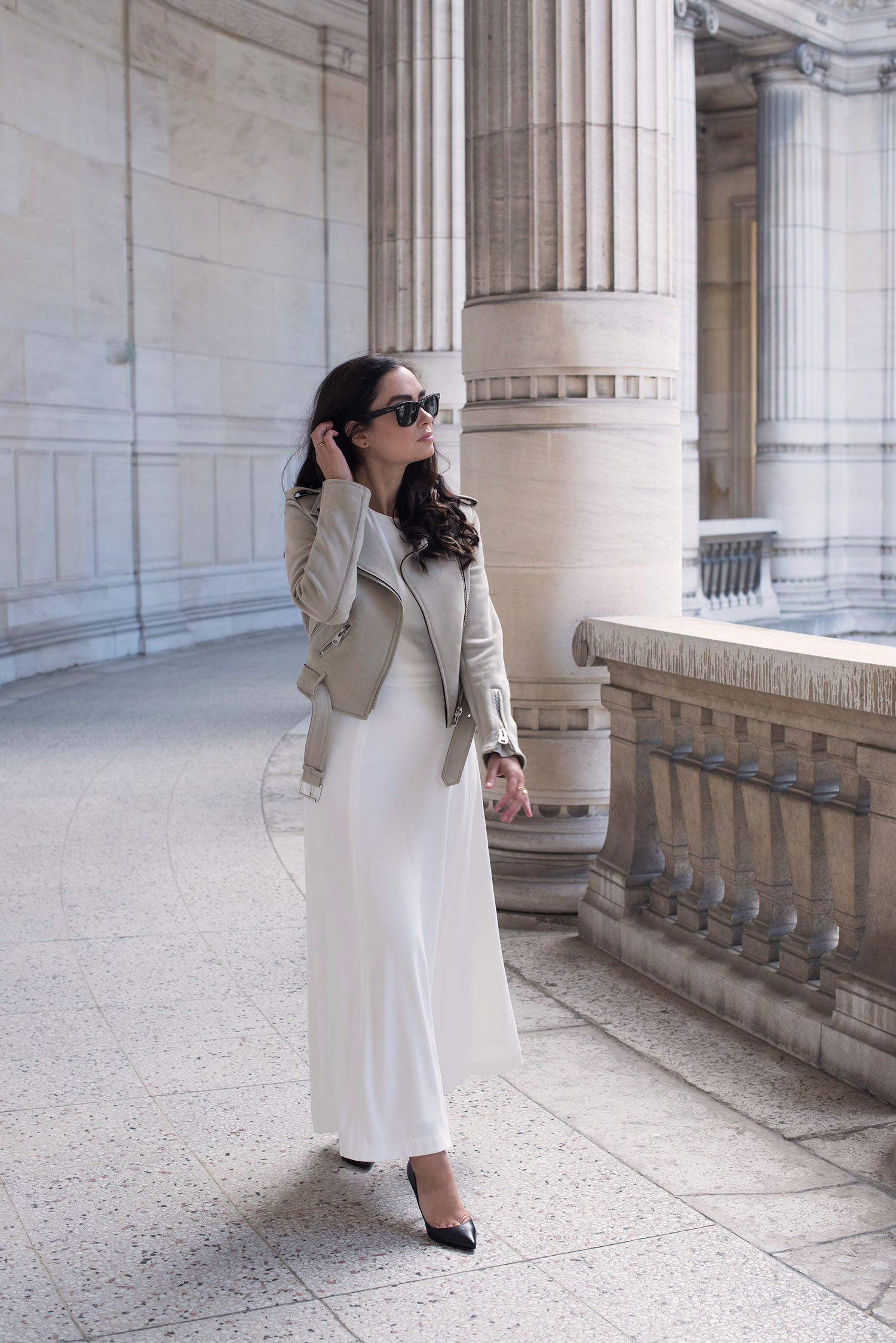 Fashion blogger Cee Fardoe of Coco & Vera walks outside Musee Galliera in Paris wearing an Ivy & Oak white dress