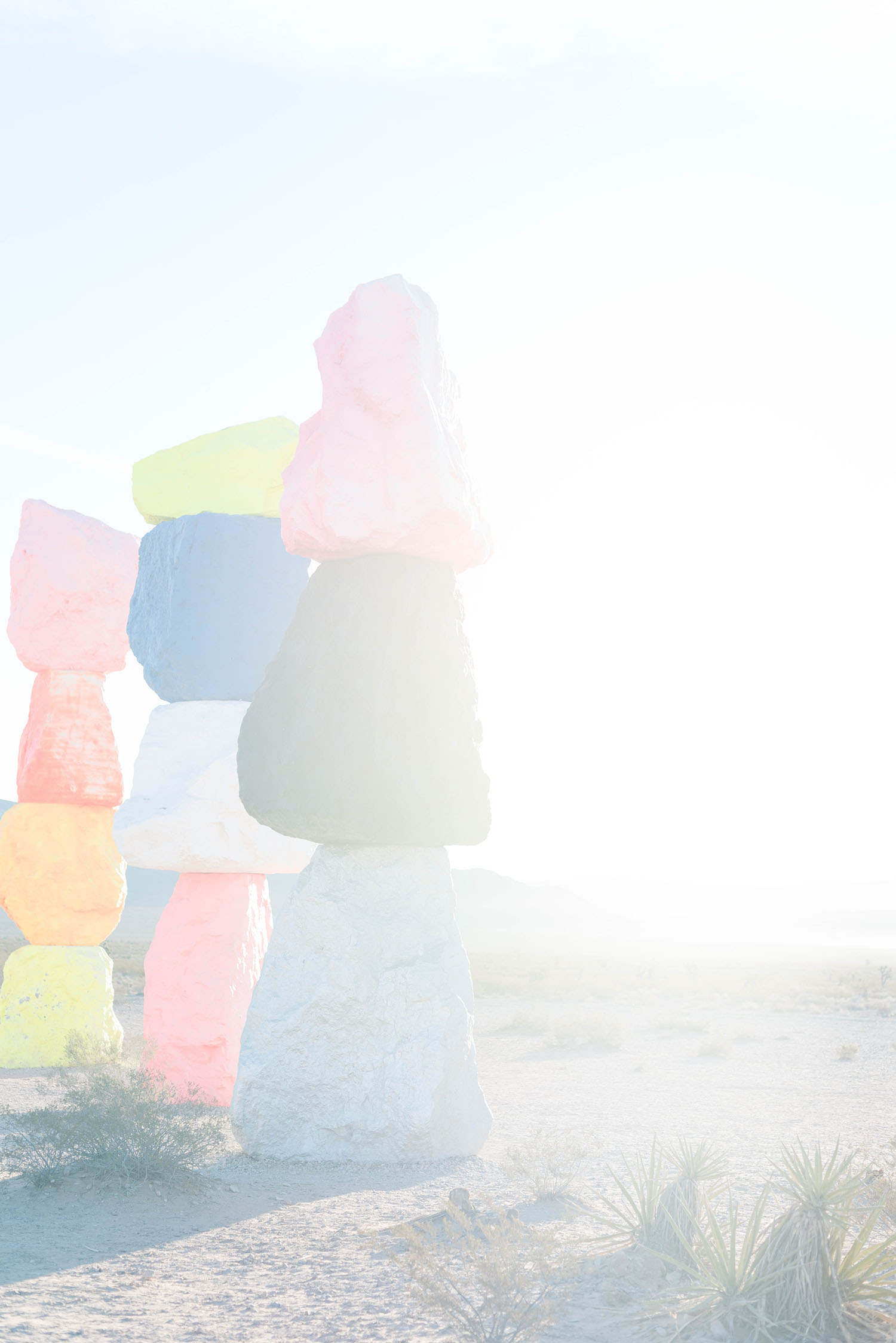 Three colourful stone formations at sunrise in the Las Vegas desert at Seven Magic mountains, as photographed by Winnipeg travel blogger Cee Fardoe of Coco & Vera