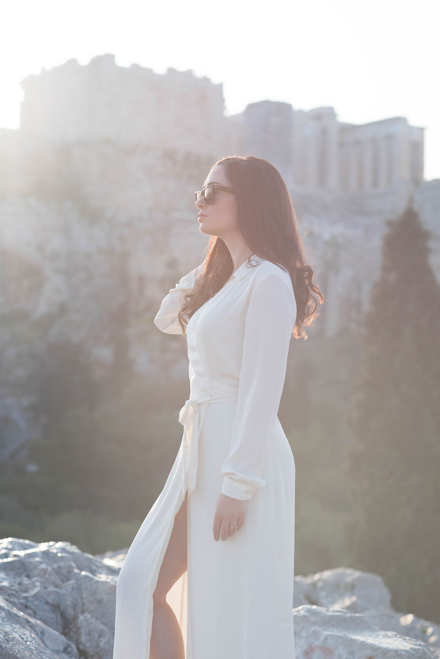 Portrait of Canadian style blogger Cee Fardoe of Coco & Vera near Acropolis Hill in Athens, Greece, wearing RayBan Wayfarer sunglasses and a Lovers + Friends white maxi dress