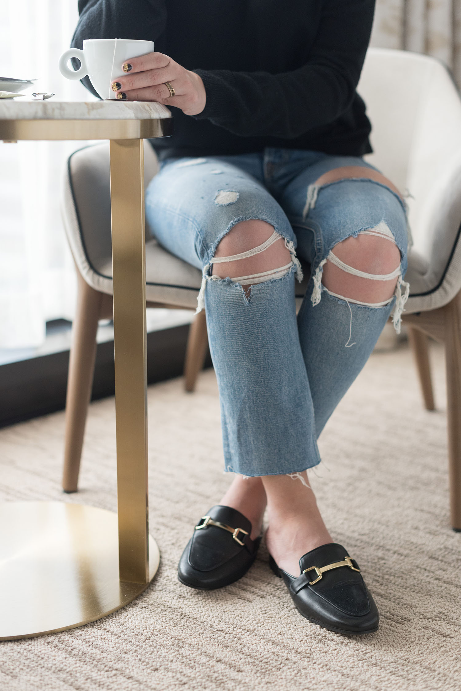 Outfit details on Canadian fashion blogger Cee Fardoe of Coco & Vera at the JW Marriott Hotel at Parq Vancouver, including Jonak mules and Grlfrnd Karolina jeans