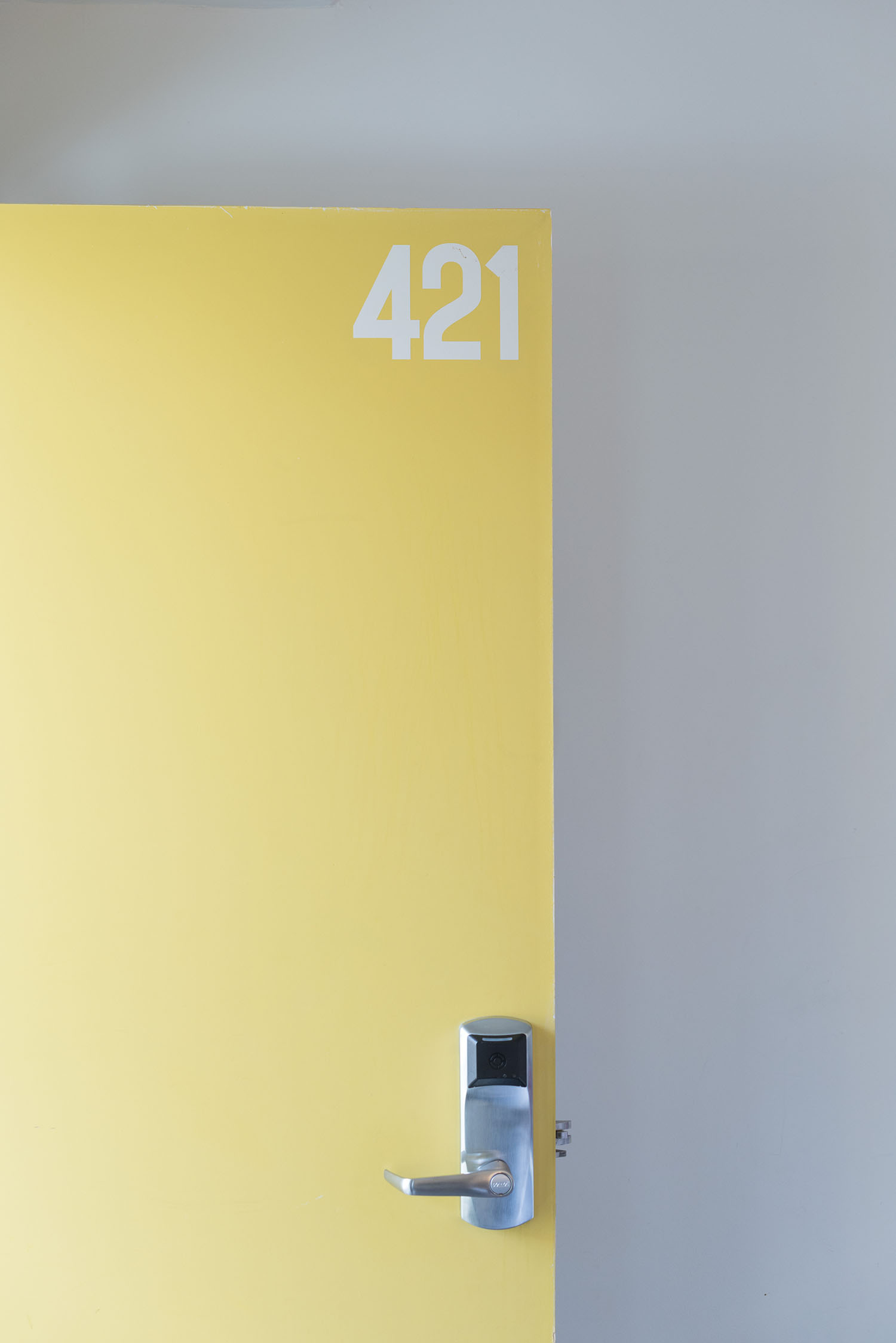 The yellow door to room 421 at The Burrard Hotel in Vancouver, as photographed by Canadian travel blogger Cee Fardoe of Coco & Vera