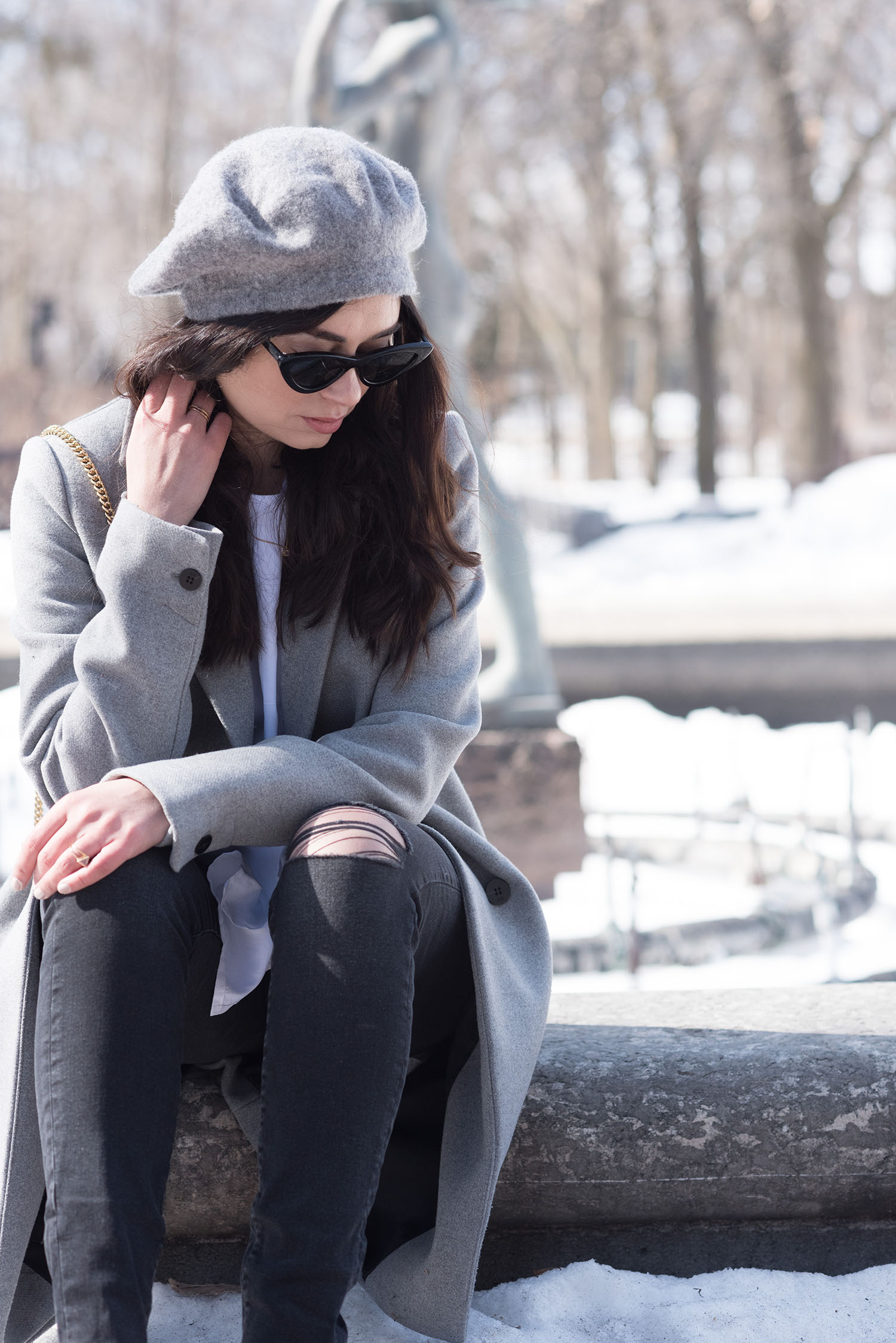 Portrait of fashion blogger Cee Fardoe, wearing Zara cat eye sunglasses and Mavi black jeans