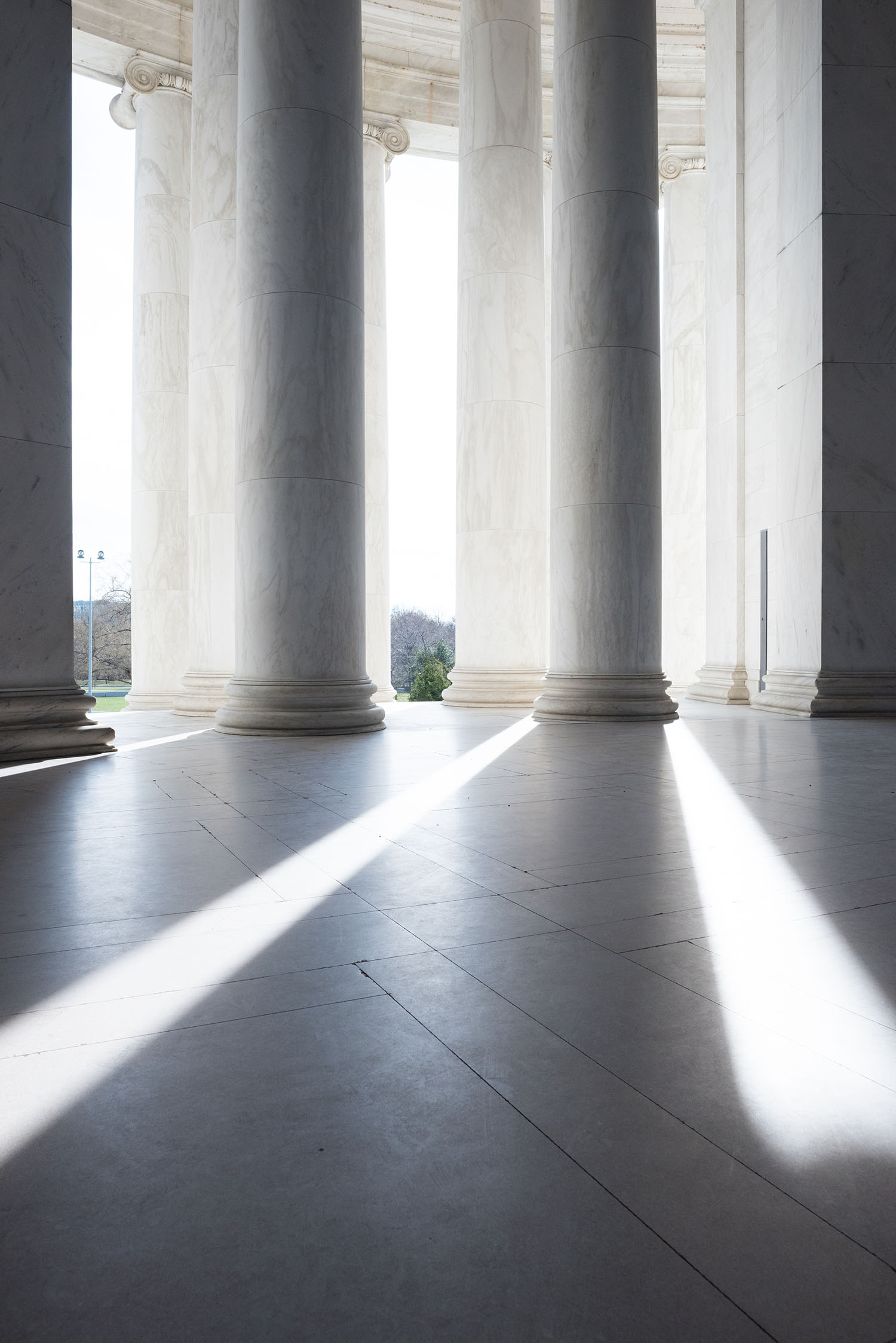Columns of sunlight at the Jefferson Memorial in Washington DC, as photographed by top travel blogger Cee Fardoe of Coco & Vera