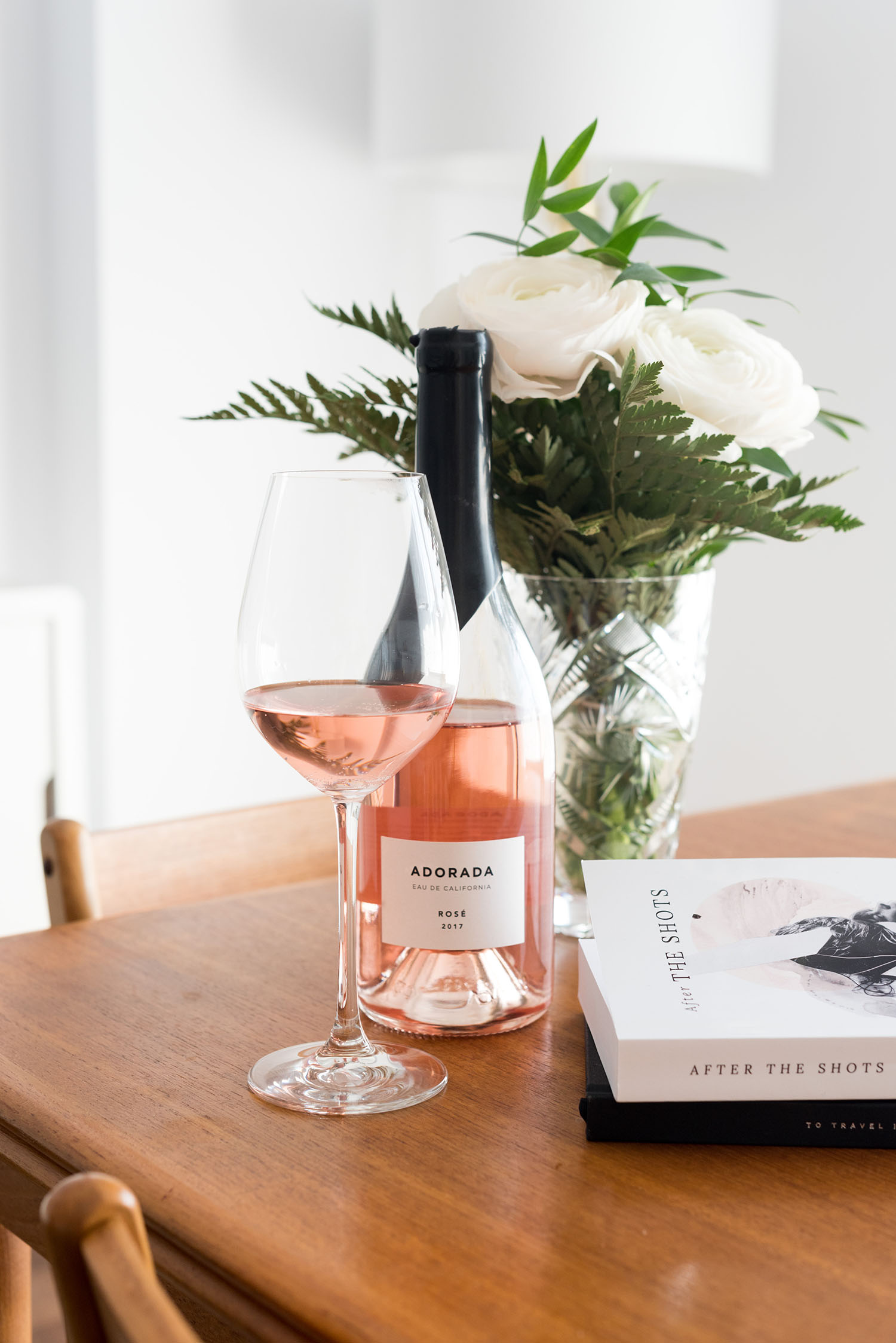 Adored rose wine and a copy of After the Shots, a novel written by top Canadian lifestyle blogger Cee Fardoe of Coco & Vera