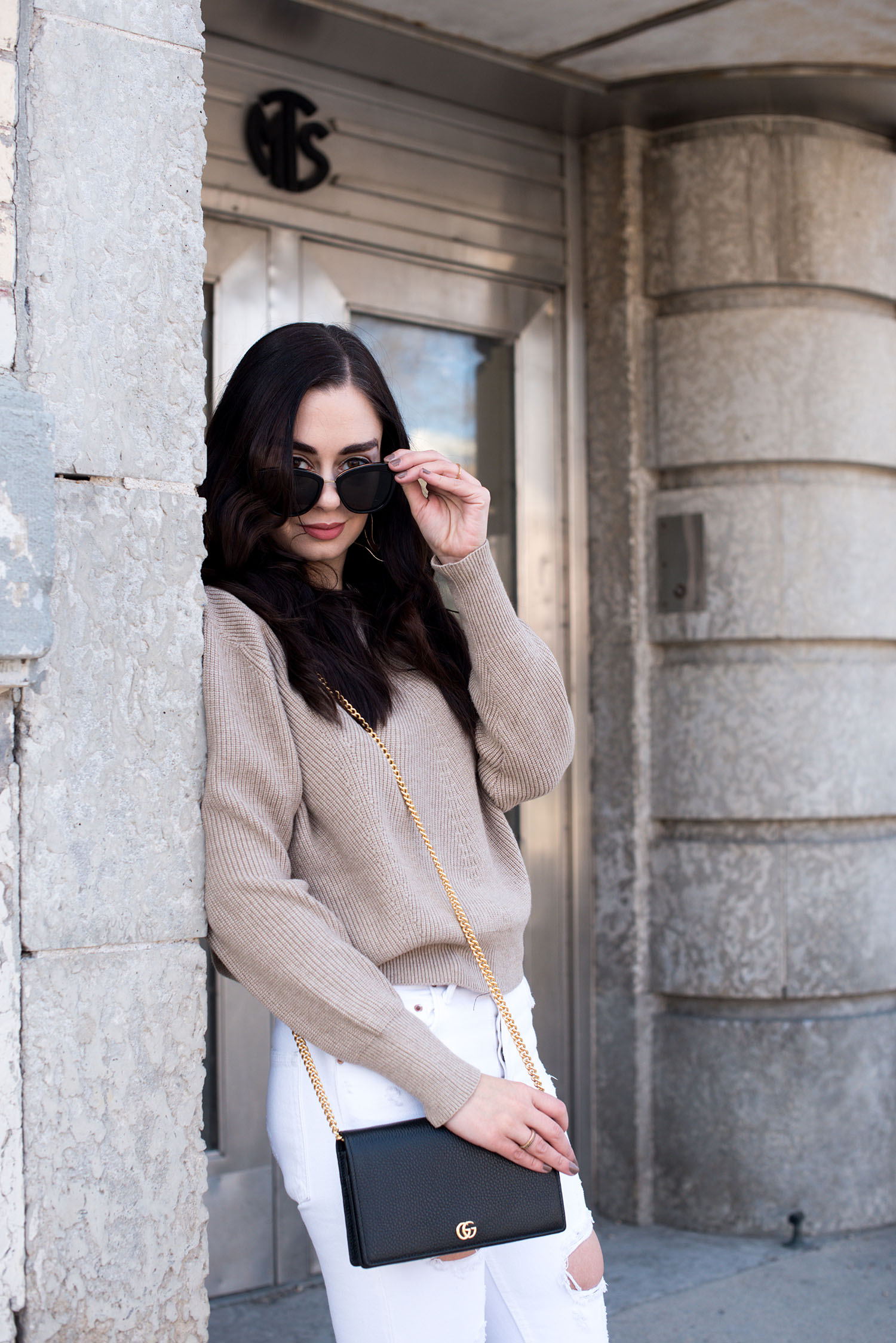 Portrait of top Canadian fashion blogger Cee Fardoe of Coco & Vera wearing Le Specs sunglasses and a beige Zara sweater
