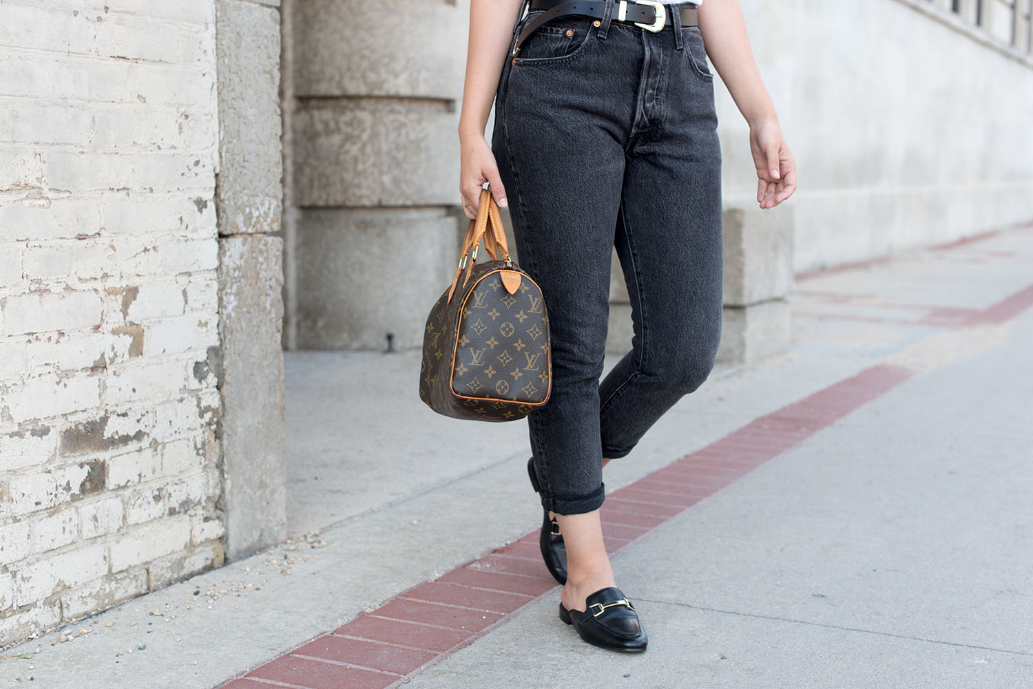 Outfit details on top Winnipeg fashion blogger Cee Fardoe of Coco & Vera, including Levi's black jeans and Jonak leather mules